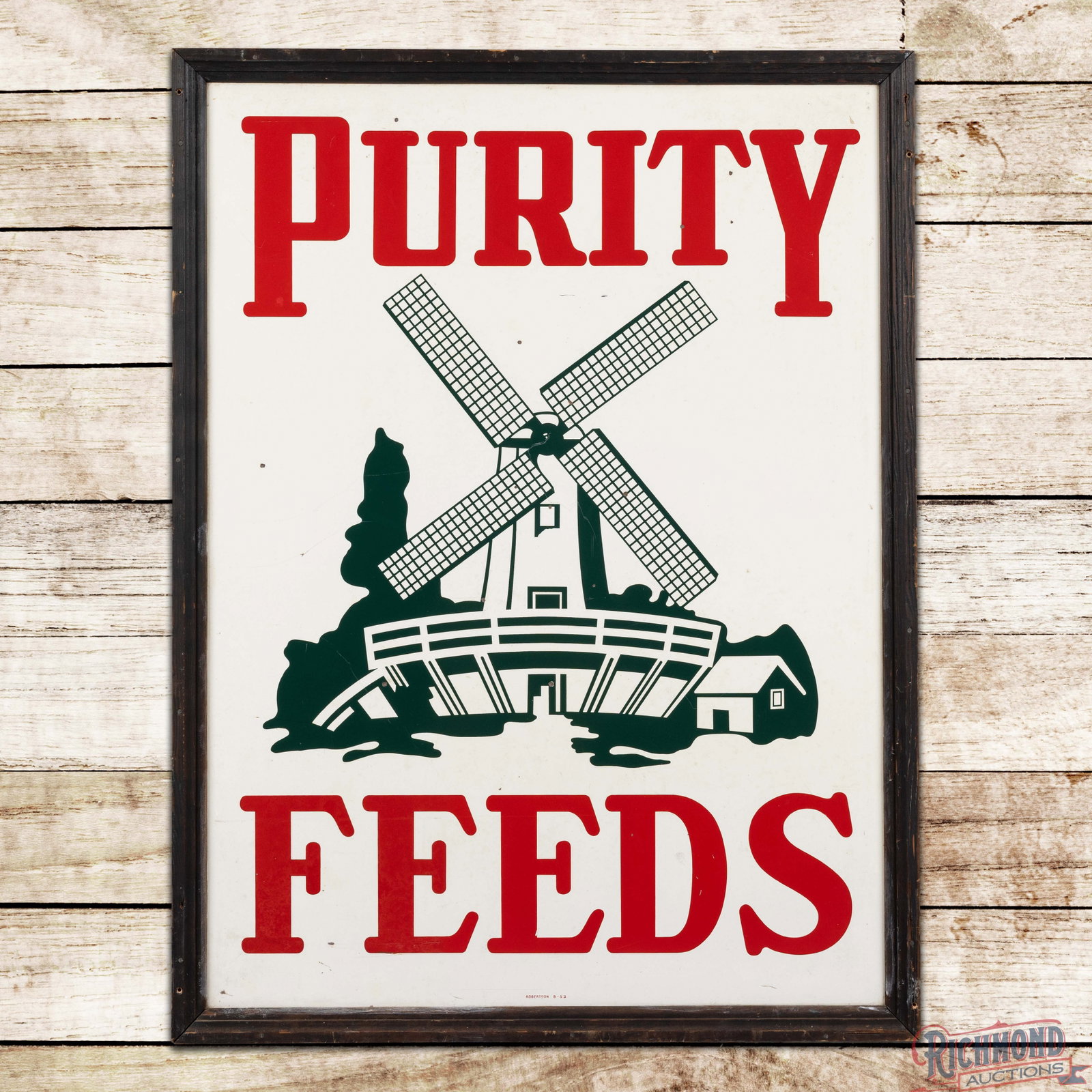 1952 Purity Feeds 48" SST Sign w/ Windmill: SST sign with the original wooden frame has excellent color and shine. The fields have light wear with tiny dings and paint chips. The wooden frame is in very good condition with minor cracks and adde
