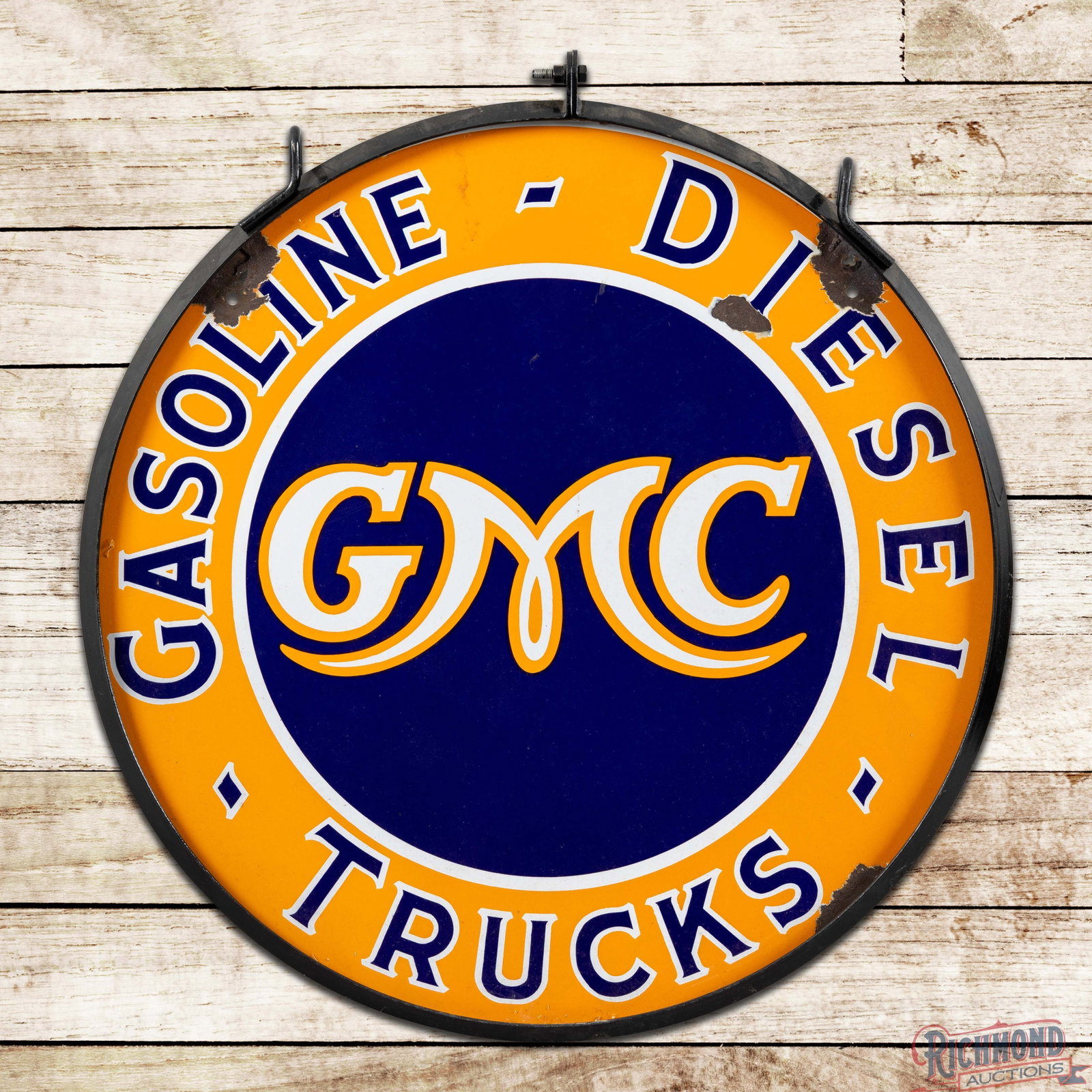 GMC General Motors Gasoline Diesel Trucks 30" DSP Sign w/ Ring: DSP sign has excellent color and gloss. The display field is clean with small chips in the outer fields. The perimeter has larger chips at the mounting holes and edges. The sign is mounted in a metal 