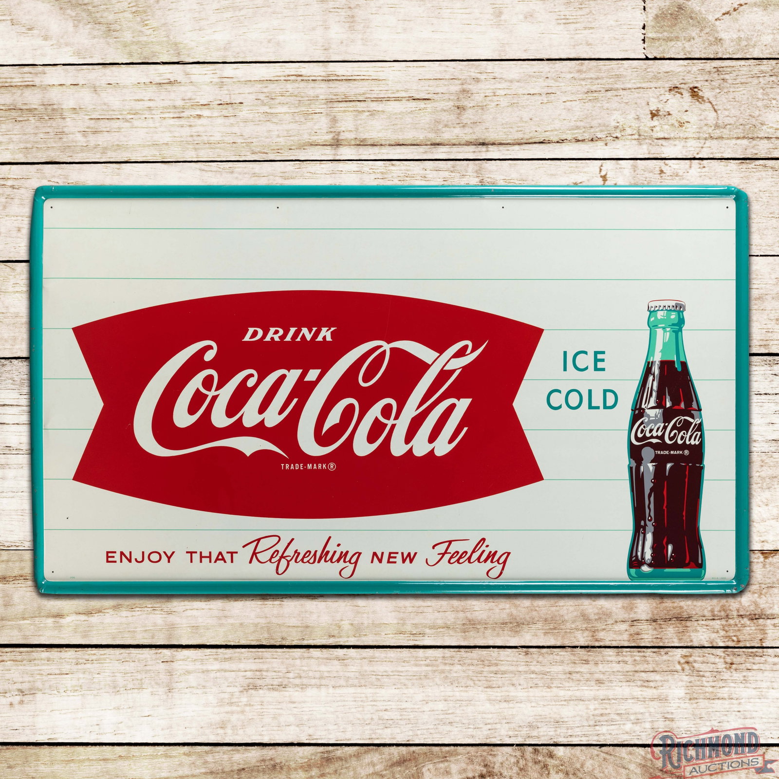 Drink Coca Cola Ice Cold "Enjoy that Refreshing New Feeling SST Sign w/ Bottle: SST self-framed sign has outstanding color and shine. The display is exceptionally clean with a tiny fine scratch to the left of the "C" in the outer left field. The perimeter has small paint chips wi
