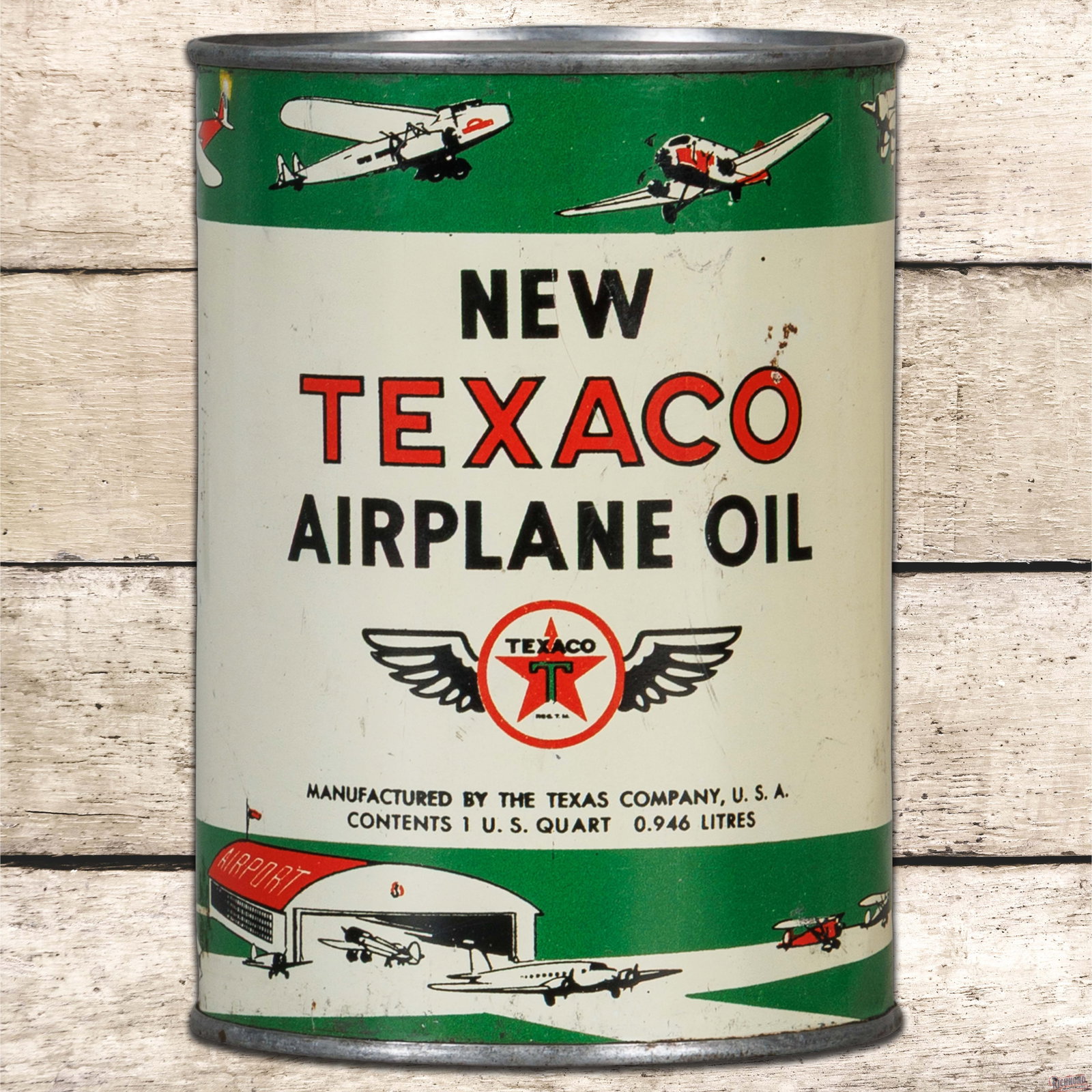 Scarce Texaco New Airplane Oil 1 Quart Metal Oil Can FULL w/ Planes: Amazing full metal one-quart can has very good color and shine. The display has light surface wear with a small area of paint loss above the "O" in Texaco. The outer fields and edges have small indent