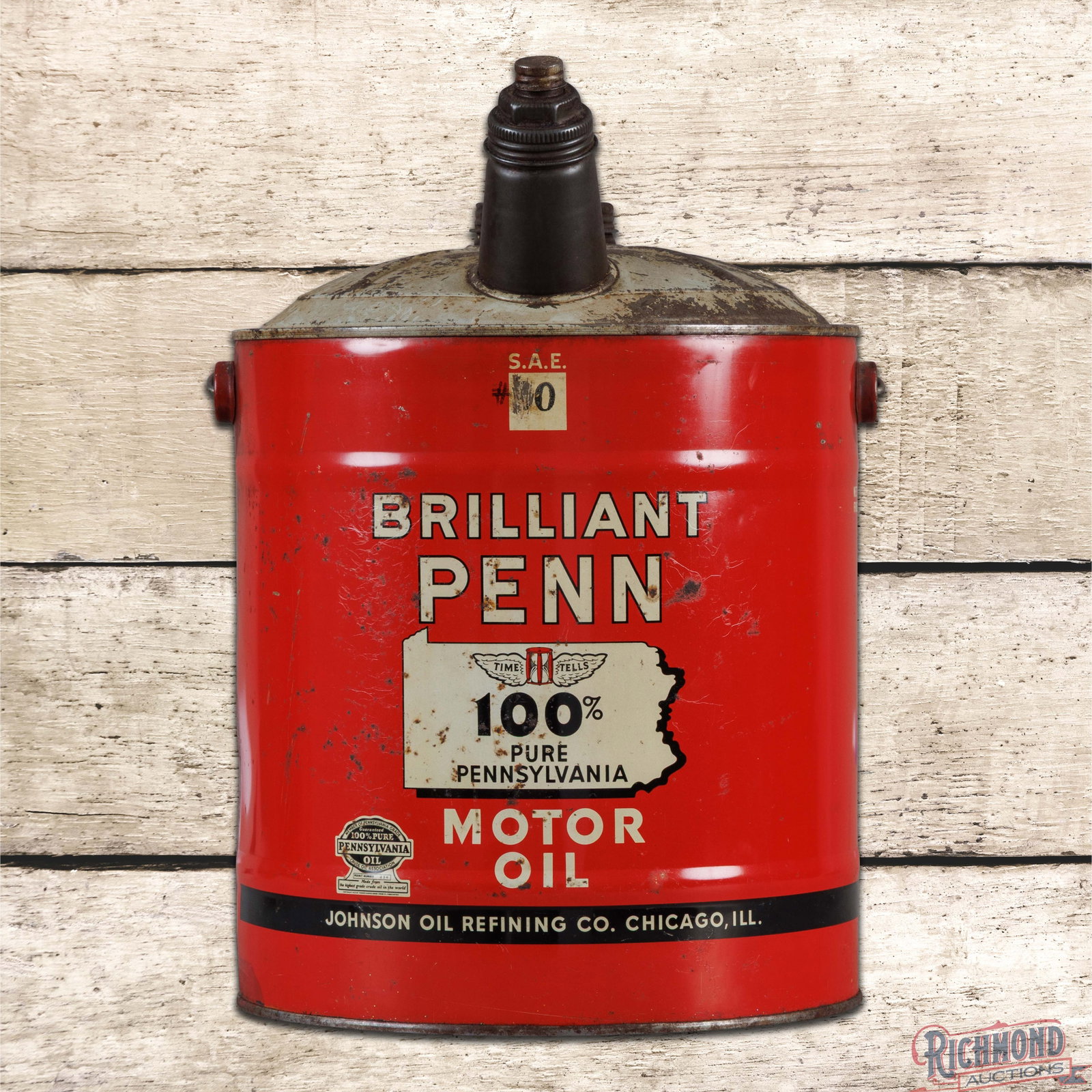 Johnson Brilliant Penn Motor Oil Empty 5 Gallon Metal Oil Can: Empty five-gallon can with the original handle and caps has excellent color and shine. Side #1 has light wear with small paint chips. The reverse has additional wear with oxidation and the can seams a