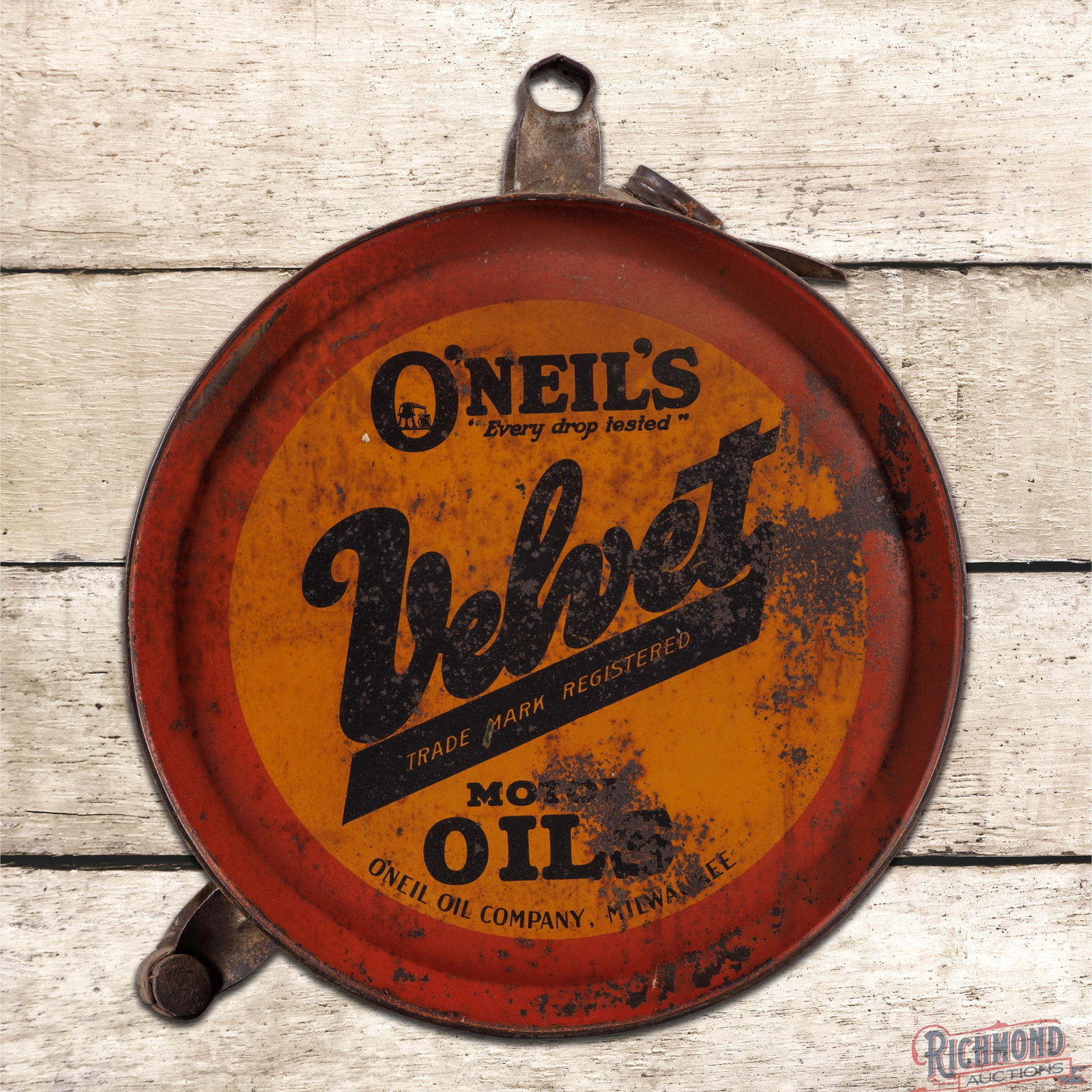 Oneil's Velvet Motor Oil Empty 5 Gallon Rocker Can: Empty five-gallon rocker can has good color and shine. The display has discoloration with light wear throughout and wash in the red outer border. The reverse has additional wear with paint loss and ox
