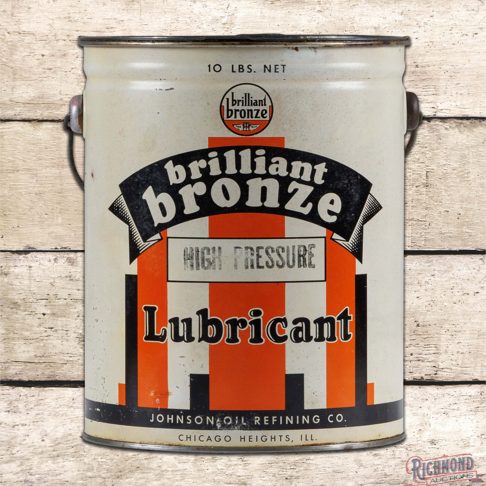 Johnson Brilliant Bronze 10 Pound Metal Grease Can: Ten pound metal grease can with the original handle and lid has excellent color and shine. The can retains grease on the inside. The display has minor spotting with small fine scratches, paint chips a