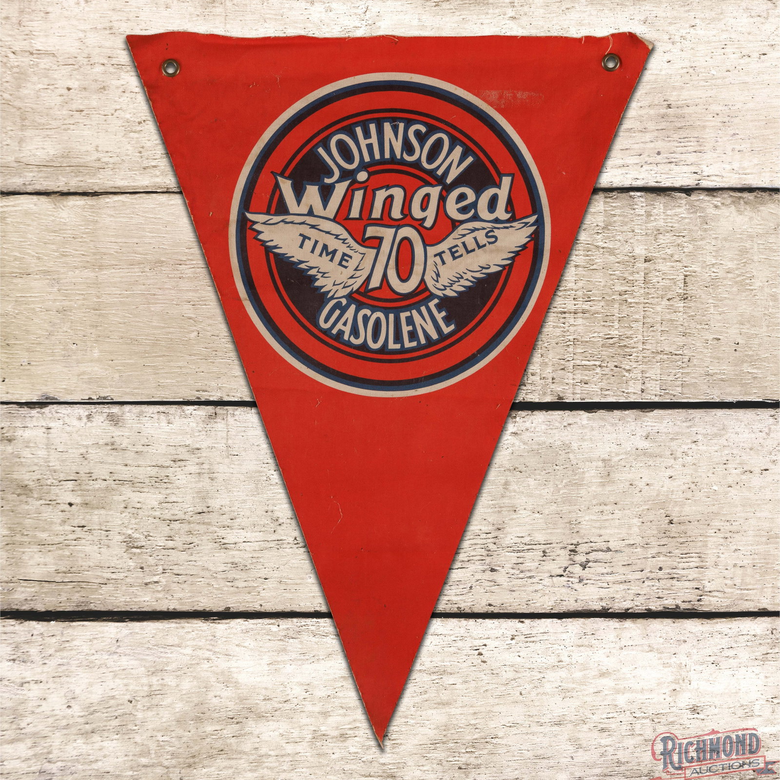 Johnson Winged 70 Gasolene "Time Tells" Banner Sign: Single sided cloth banner has very good color. The display has light wear with minor toning to the white and an area of white discoloration in the upper right outer field. The perimeter has fraying al