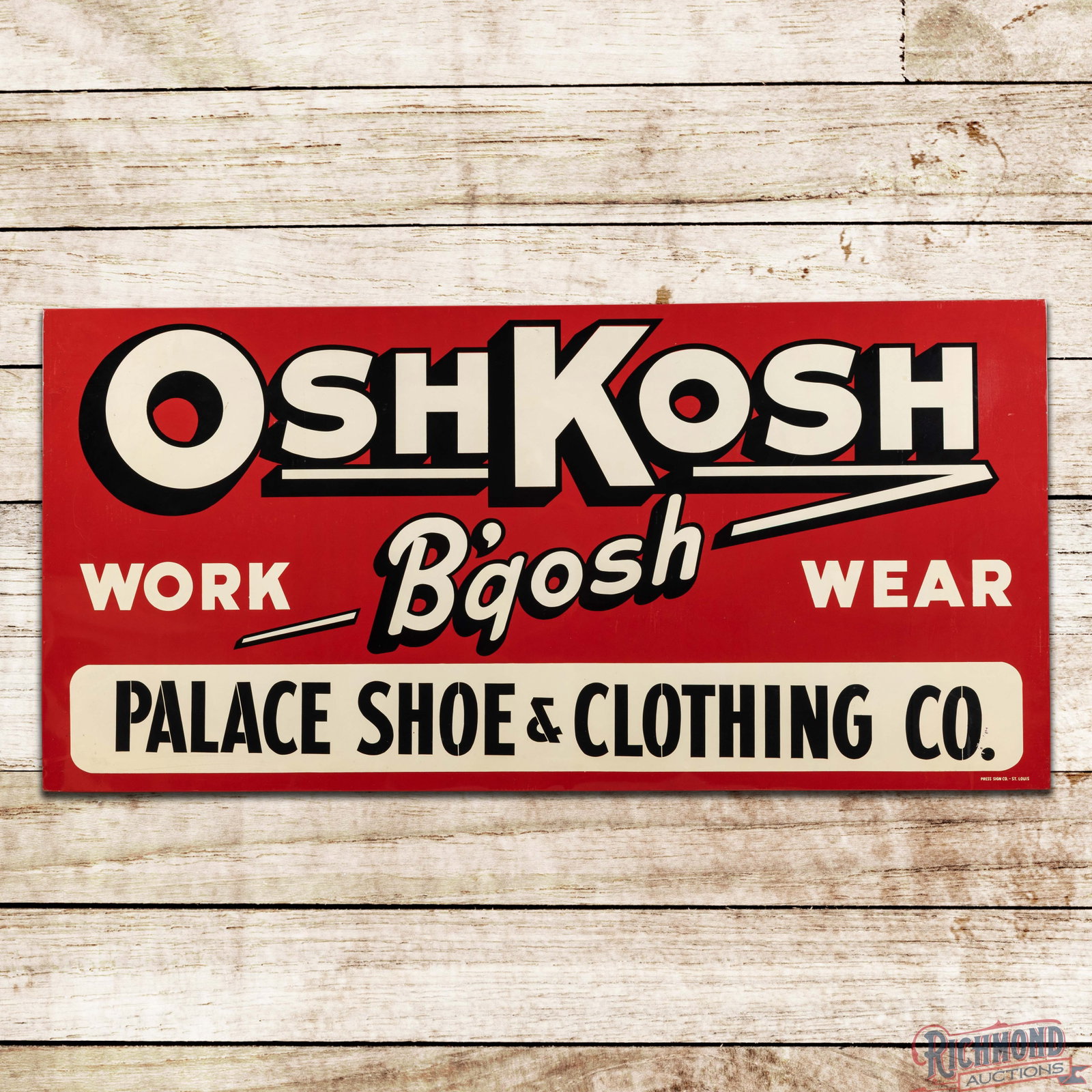 OshKosh B'gosh Work Wear Palace Shoe & Clothing Co. 6' SST Sign: SST sign with the factory wooden support frame has excellent color and shine. The display is clean with minor paper marks. The perimeter has small scuffs and light wear along the lower edges. The wood