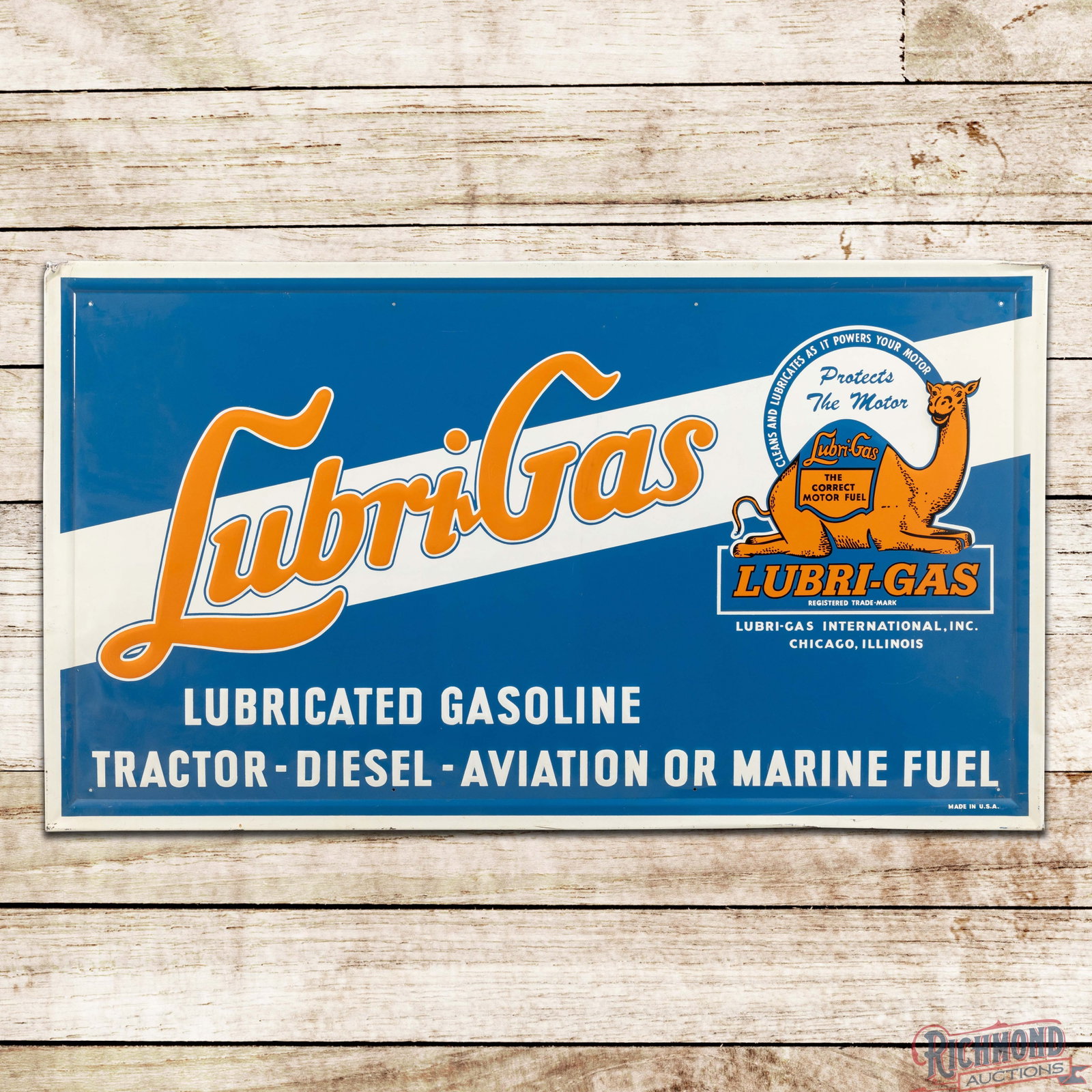 Lubrigas Gasoline Tractor Diesel Aviation Marine Fuel 56" Emb. SST Sign w/ Camel: SST embossed self-framed sign has excellent color and shine. The sign features vibrant color throughout with a large, detailed graphic of the Lubrigas camel. The fields are clean. minor imperfections.