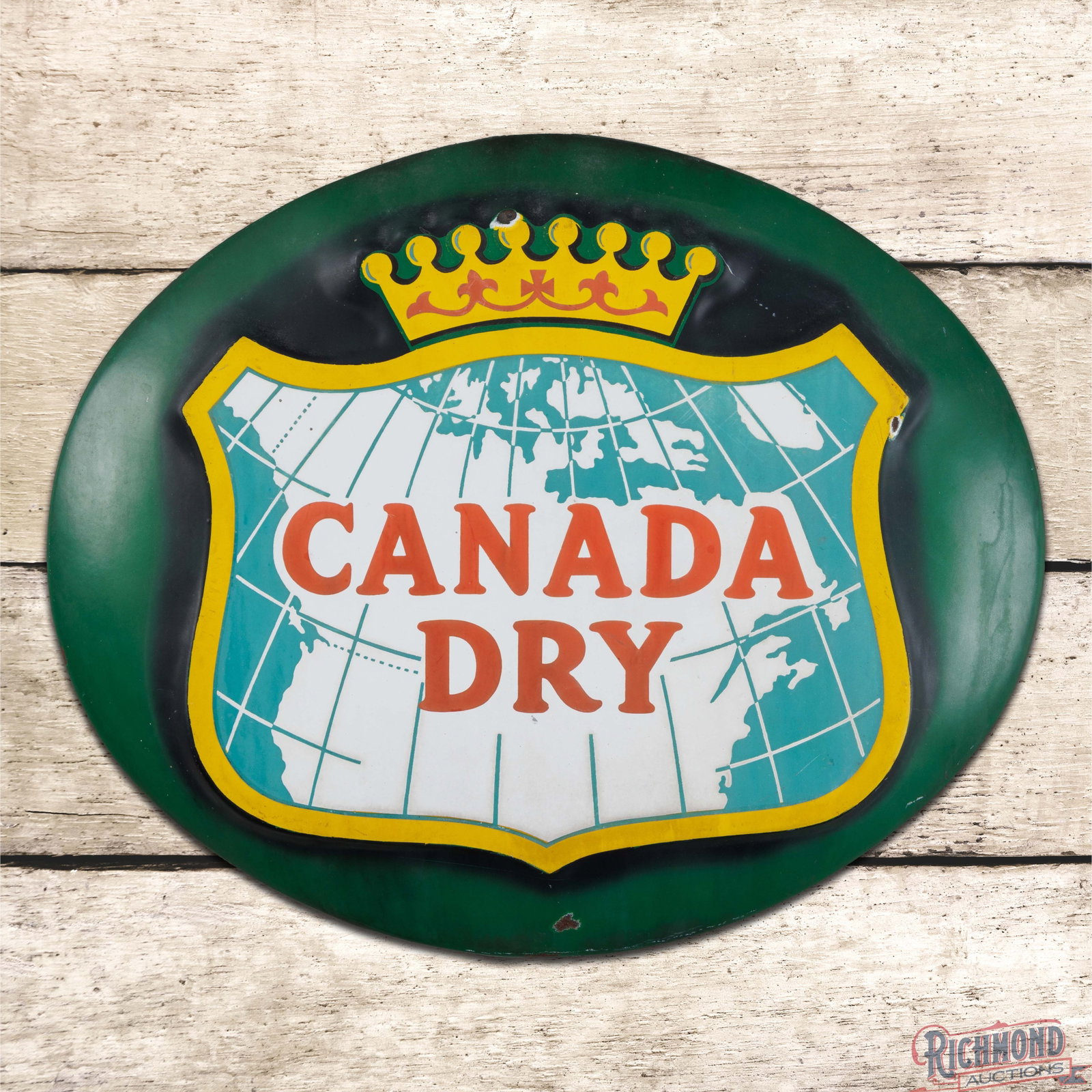 Canada Dry SSP Convex Button Sign w/ Logo: SSP die cut button sign has good color and gloss. The display has slight fading with chips on the upper edges of the logo. The perimeter has toning with additional small chips and a faint Boos Hahn ma