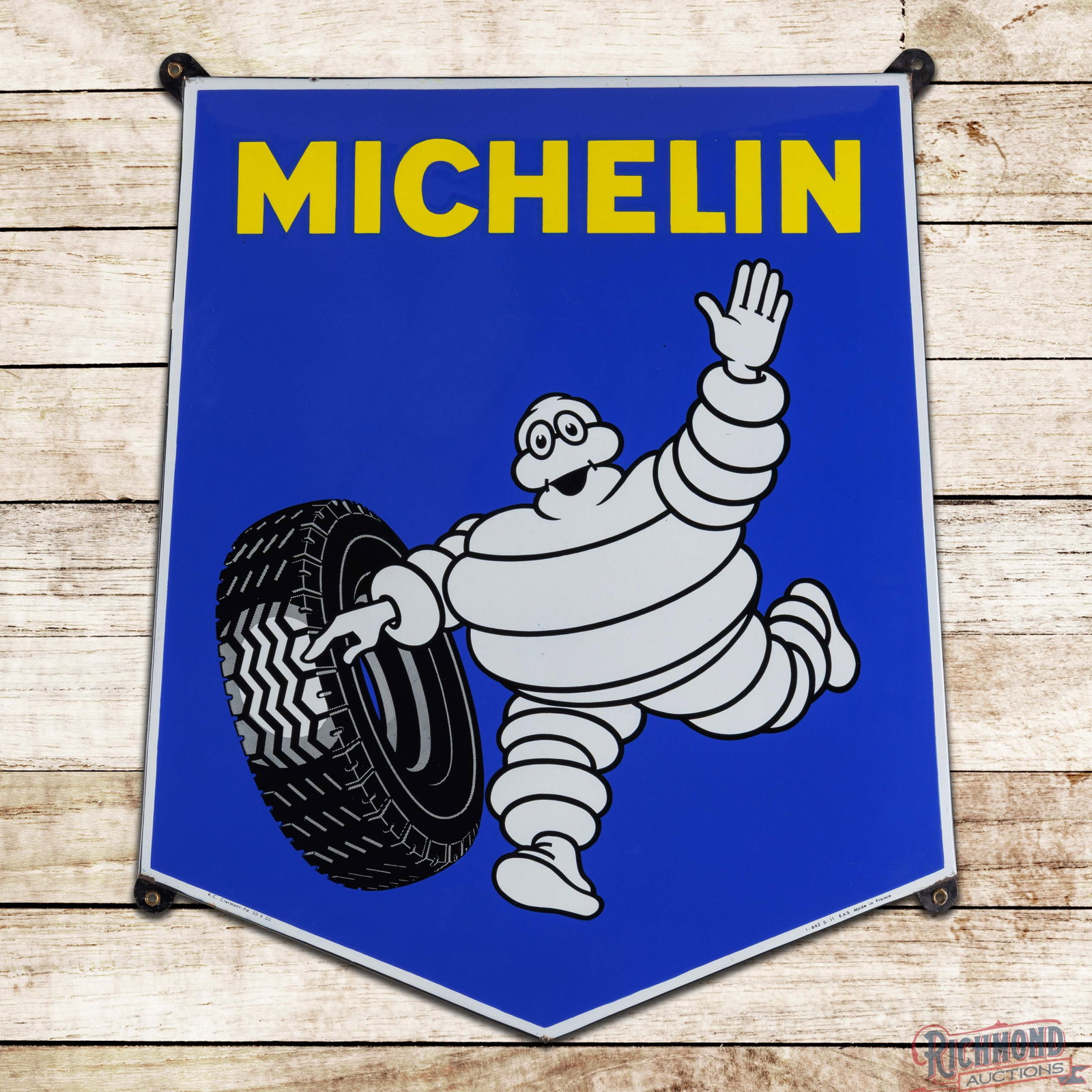 Michelin Tires Die Cut 32" SSP Sign w/ Bibendum: SSP die cut rolled edge sign has excellent color and gloss. The field is clean. The perimeter has minor chipping along the outer edges. Marked R.C. Clermont - Fd. 55 B 50 Made in France. Overall an ou