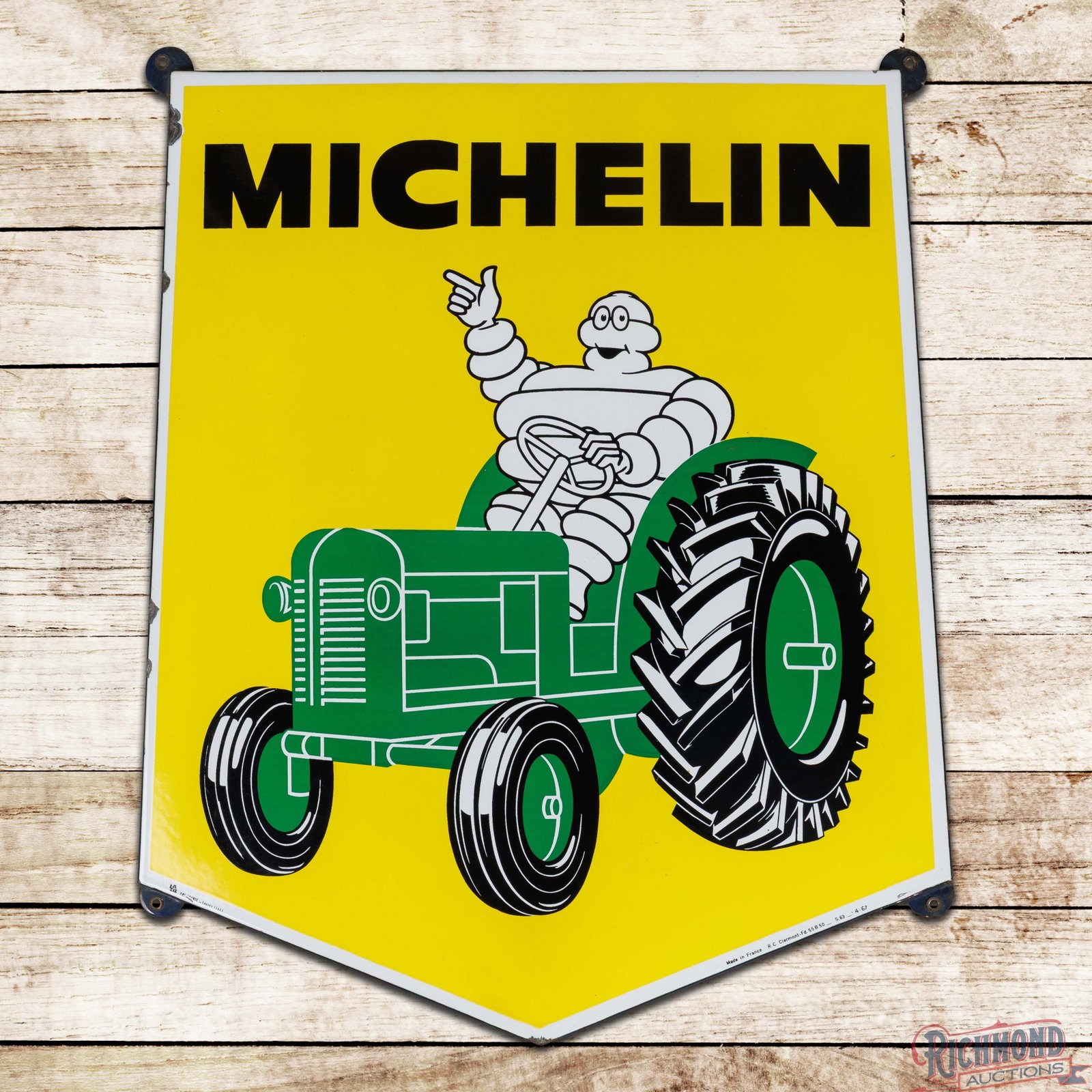 Michelin Farm Tires 32" SSP Sign w/ Bibendum & Tractor: SSP rolled-edge sign has excellent color and gloss. The field is clean. The perimeter has chips along the outer rolled edges. All four factory grommets are present and the sign is marked Art France Ly