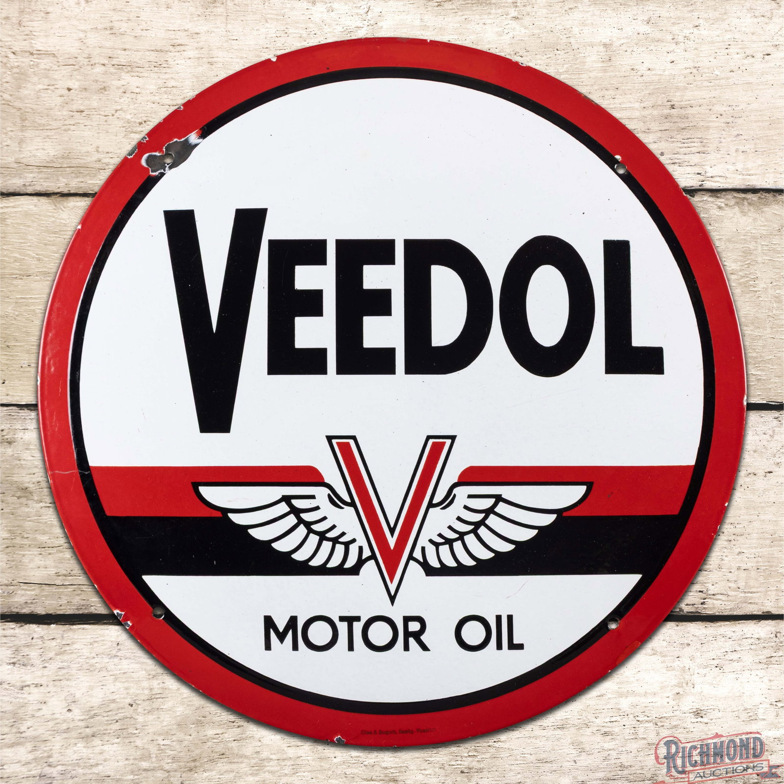 Veedol Motor Oils 19.5" SSP Sign w/ Logo: SSP convex sign has excellent color and gloss. The field is very clean overall with minor surface imperfections. The perimeter has a chip at the upper left mounting hole with other small chips along t