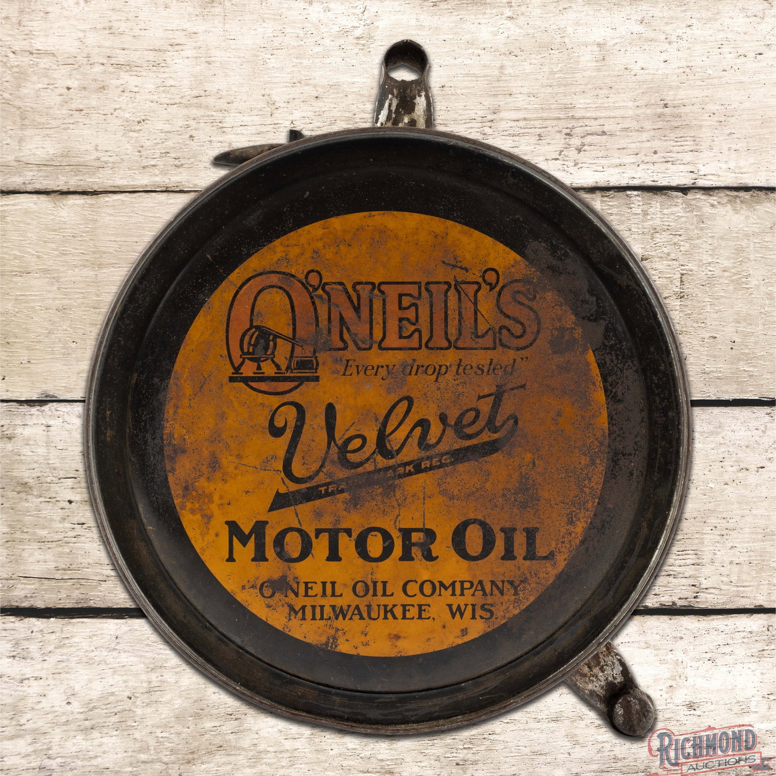 Oneil's Velvet Motor Oil Empty Metal Rocker Can: Empty five-gallon rocker can with the original cap has moderate color and shine. The display has general age-related wear with paint loss, oxidation and scratches. The reverse has heavier paint loss. 