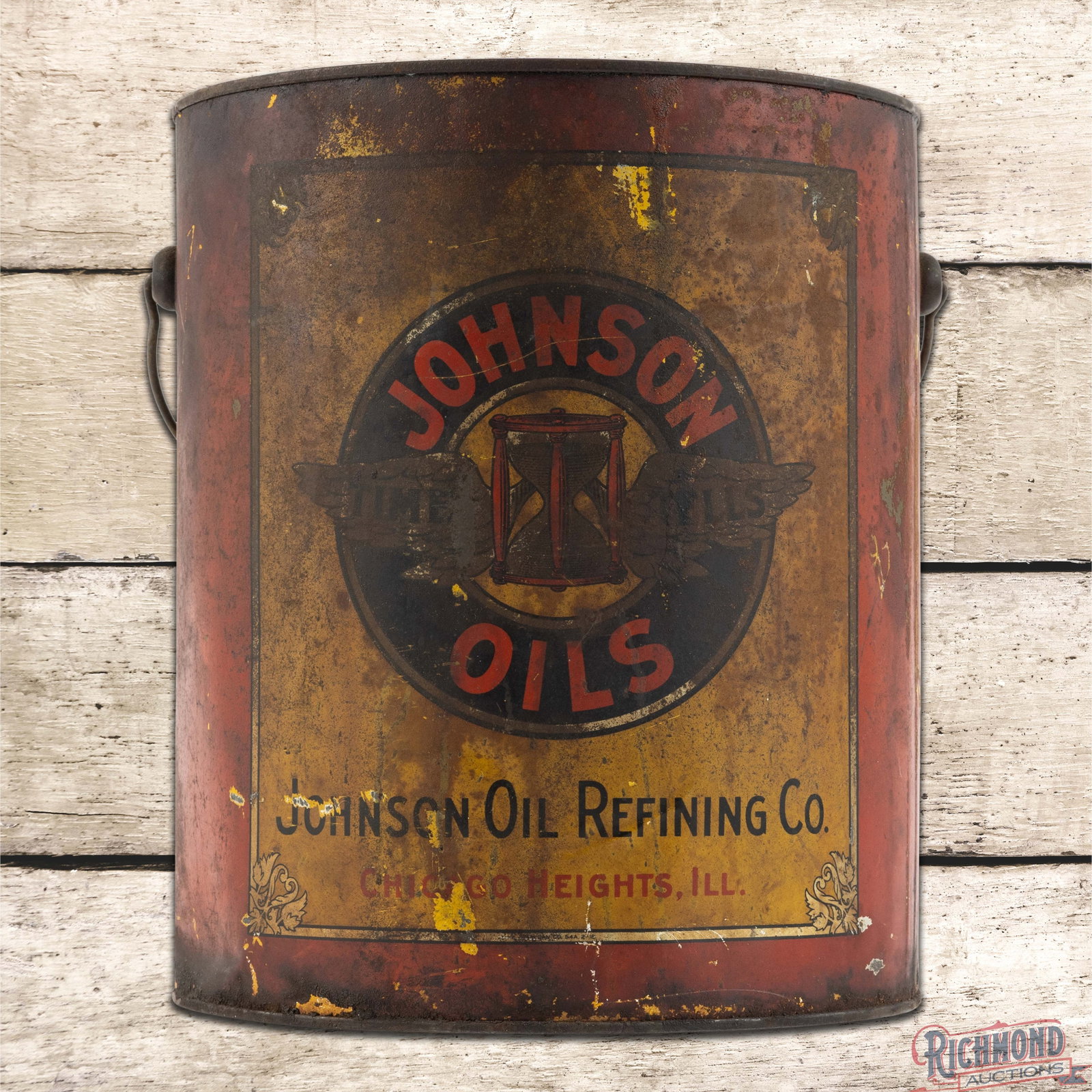 Early Johnson Oil Refining Co. Empty 25 Pound Metal Grease Can Chicago Heights Illinois: Empty 25 pound metal grease can with the original handle and lid has moderate color and shine. The display has wear with discoloration, scuffs and paint chips. The reverse has wash and discoloration i