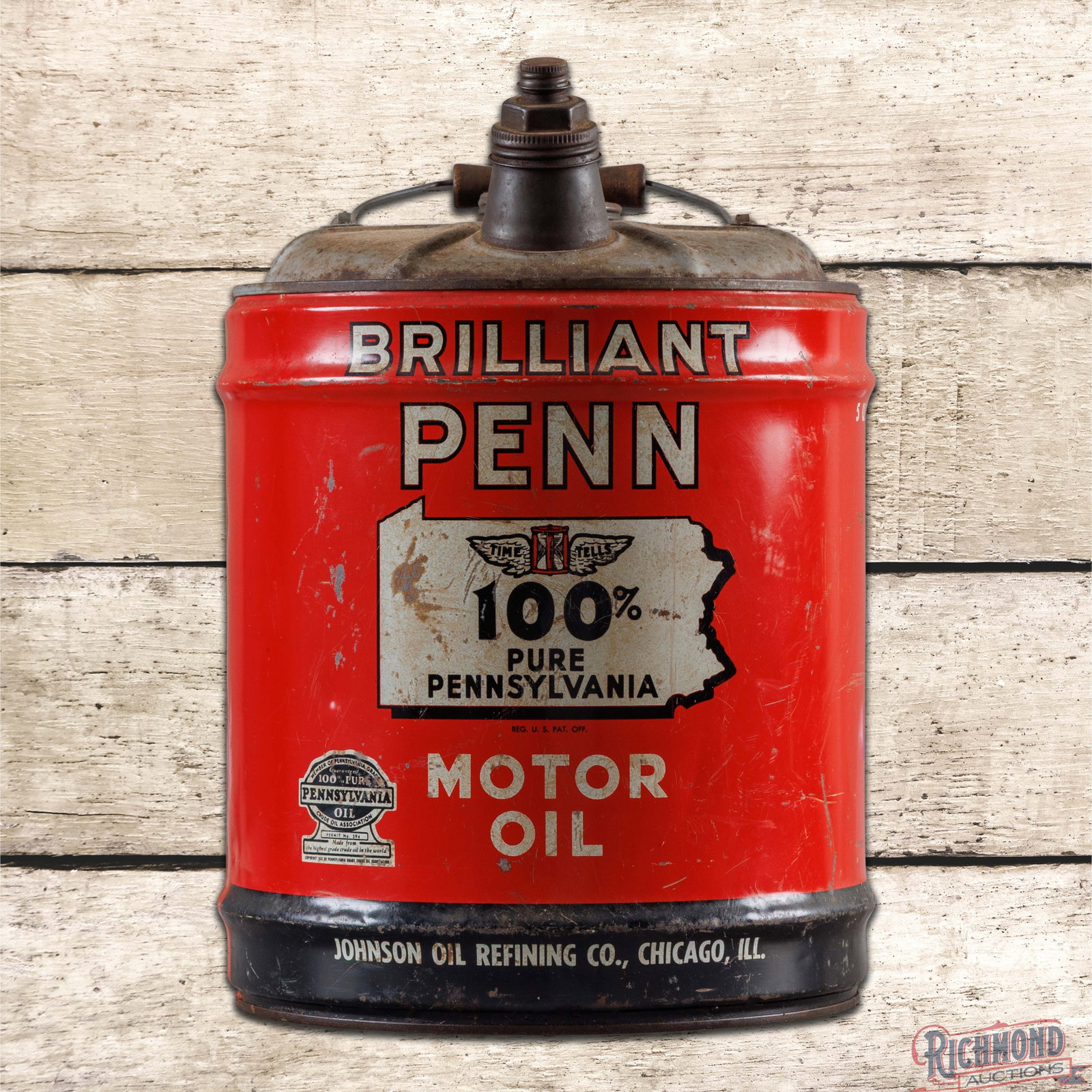 Johnson Brilliant Penn 100% Pure Pennsylvania Motor Oil Empty 5 Gallon Metal Oil Can: Empty five-gallon can has good color and shine. The can retains the handle and both caps. The display has surface wear with fine scratches, paint chips and minor indentations. The reverse has slightly