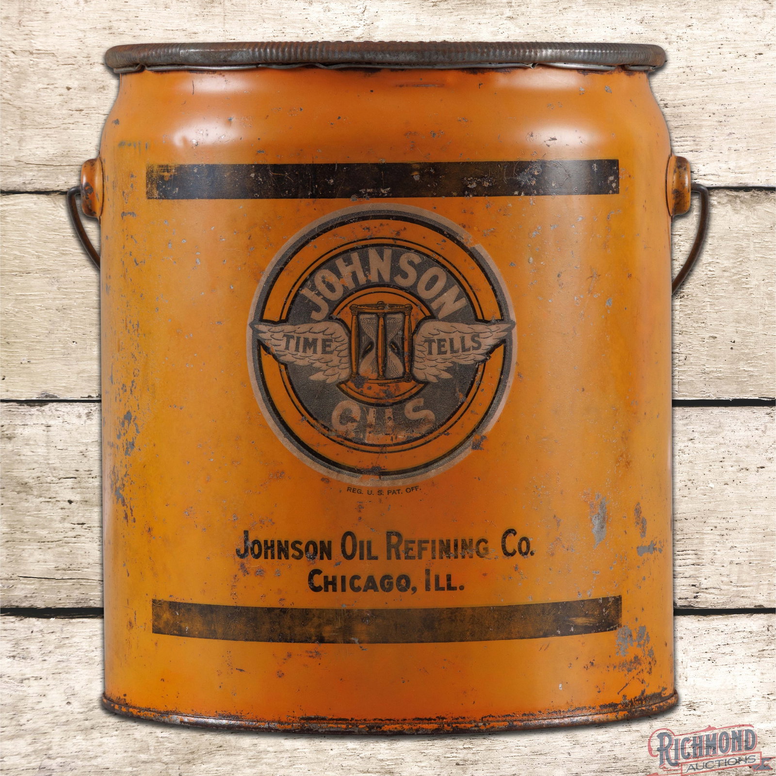 Johnson Oil Refining Co. Empty 5 Gallon Metal Motor Oil Can: Empty five-gallon metal can with the original handle and cap has good color and moderate shine. Side #1 features the "Time Tells" logo with fading, oxidation and paint chips. The reverse has additiona