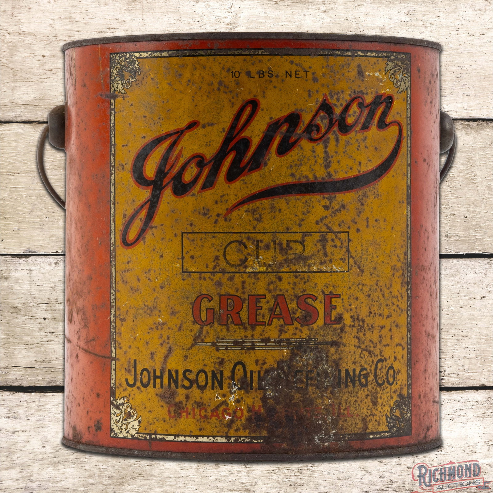 Early Johnson Oil Refining Co. Empty 10 Pound Metal Grease Can Chicago Heights Illinois w/ Logo: Empty ten-pound metal grease can with the original handle and lid has moderate color and shine. The display has general wear with oxidation, paint chips and an area of metal loss on the lower edge. Th
