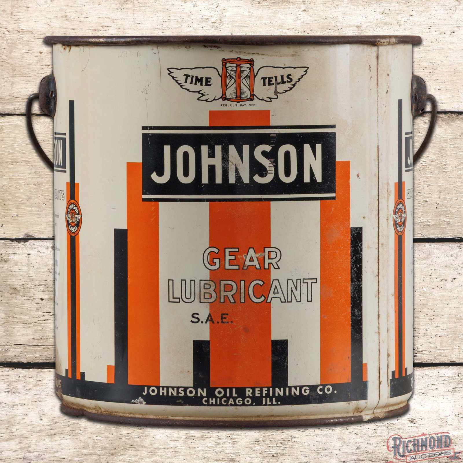 Johnson "Time Tells" Gear Lubricant Empty 25 Pound Metal Grease Can w/ Logo: Empty 25-pound metal can has very good color and shine. The display has light wear with scuffs and minor discoloration. The reverse has additional wear in the lower field and bottom edge. The factory 