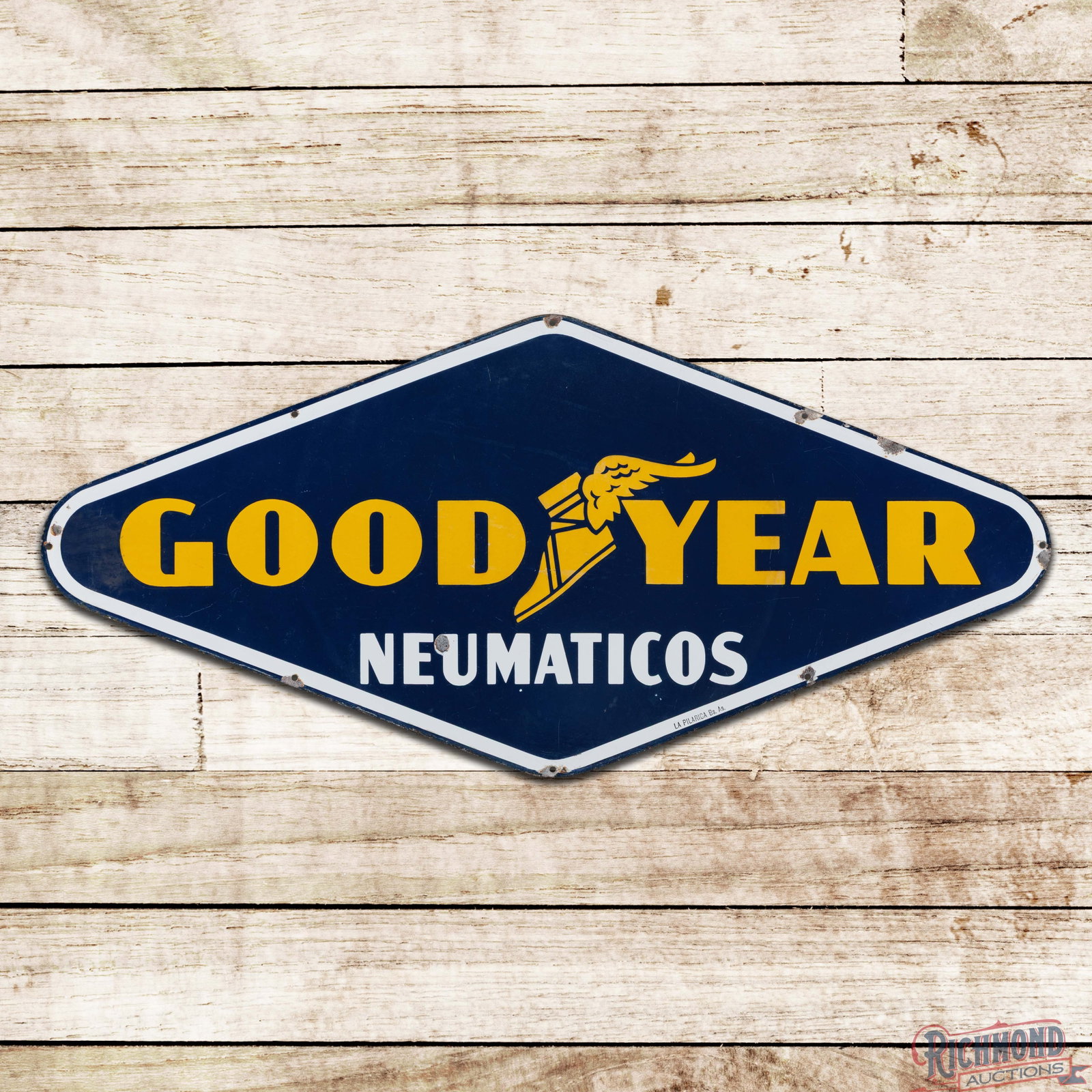Goodyear Tires Neumaticos 4' SSP Sign w/ Wingfoot: SSP die cut sign has very good color and gloss. The display has light surface wear with a chip in the lower left field. The perimeter has chips at the mounting holes and edges. Marked La Pilarica Bs. 