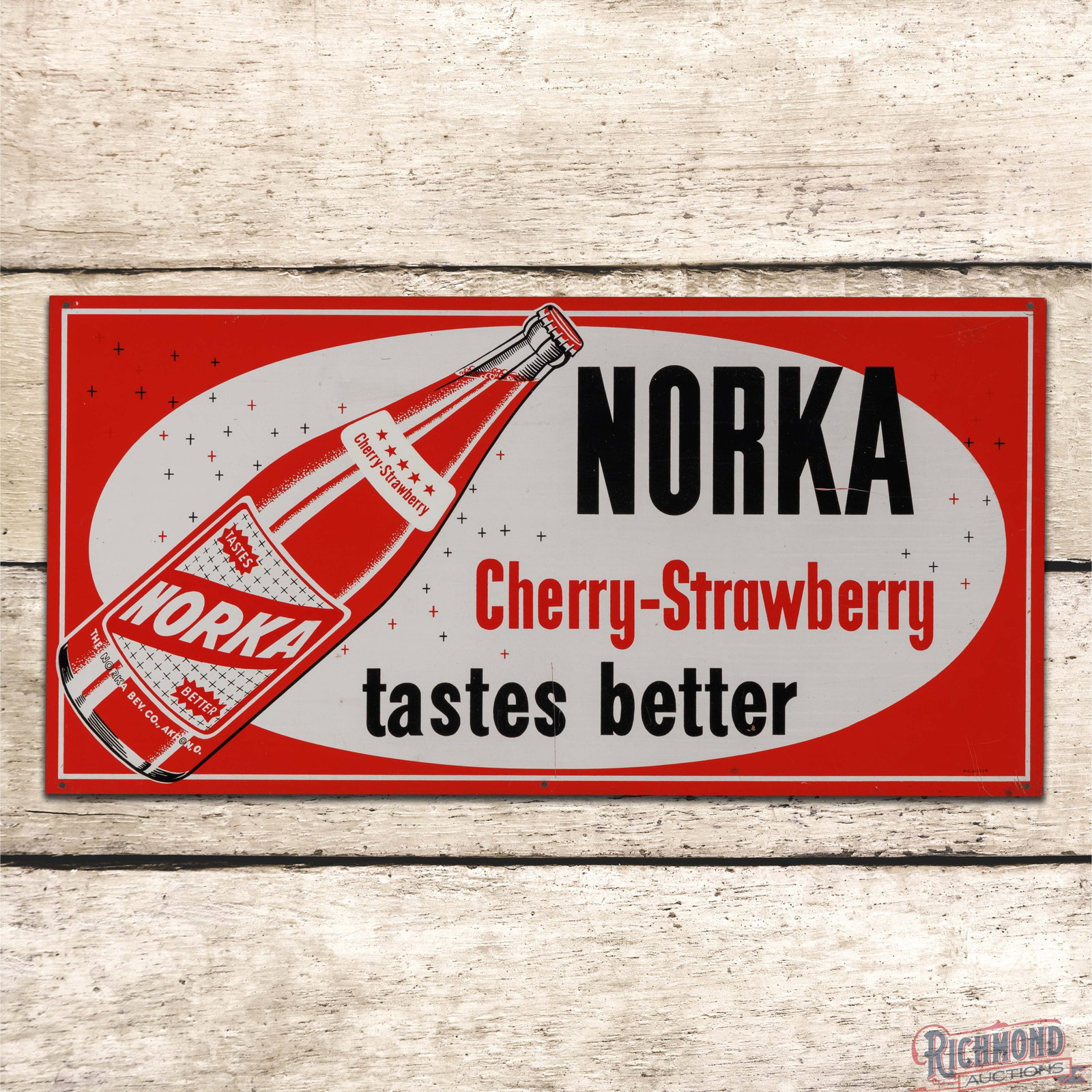 Norka Cherry Strawberry "Tastes Better" SST Sign w/ Bottle Akron Ohio: SST sign has excellent color and shine. The field has light wear with a scratch in the lower and right fields. The perimeter has small scratches on the lower right corner. Marked M-C-A-1229. All in al