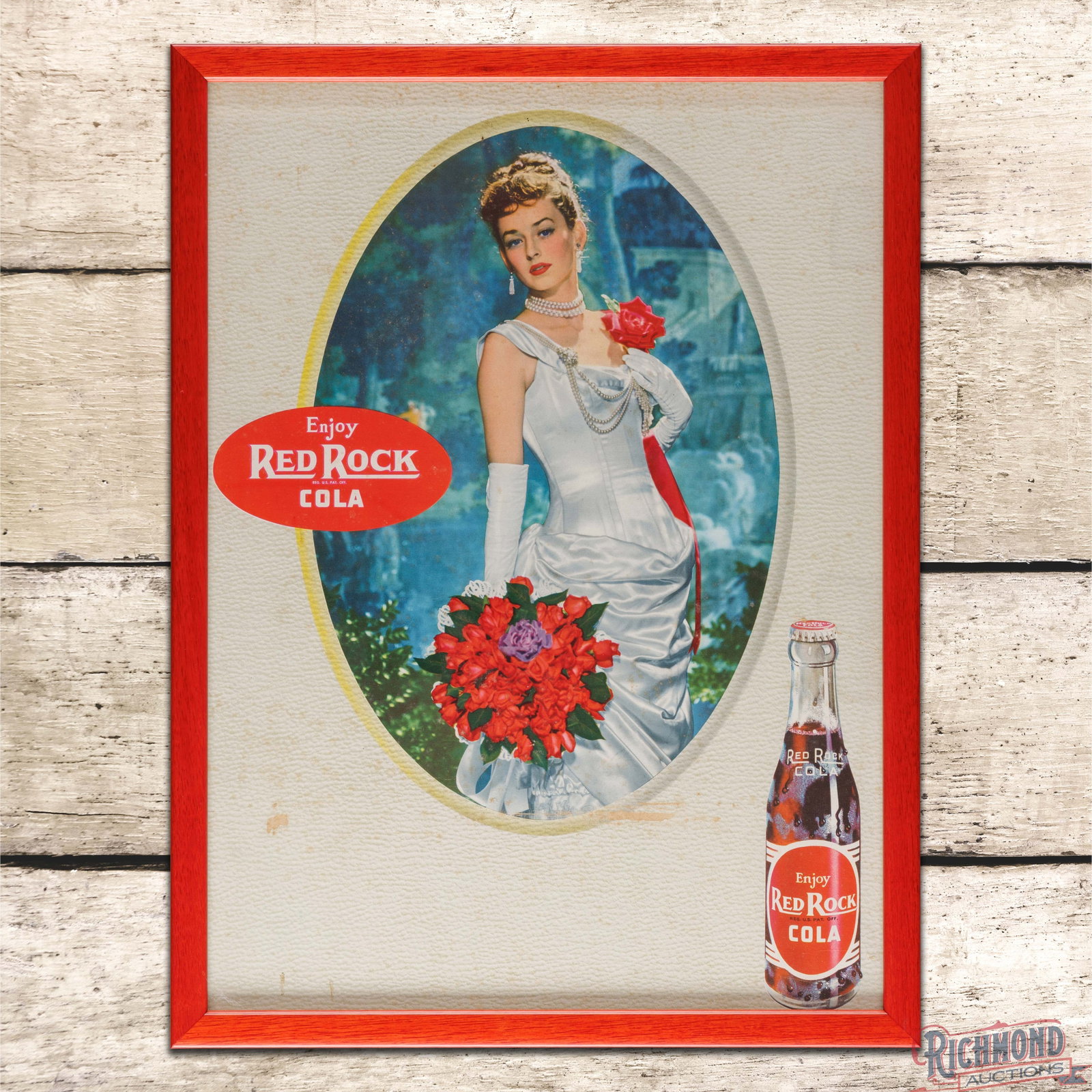 Enjoy Red Rock Cola SS Cardboard Sign w/ Lady & Bottle: Single sided cardboard sign has been framed under glass. The sign has excellent color with areas of discoloration and surface wear that are primarily in the lower fields. The perimeter has closed tear