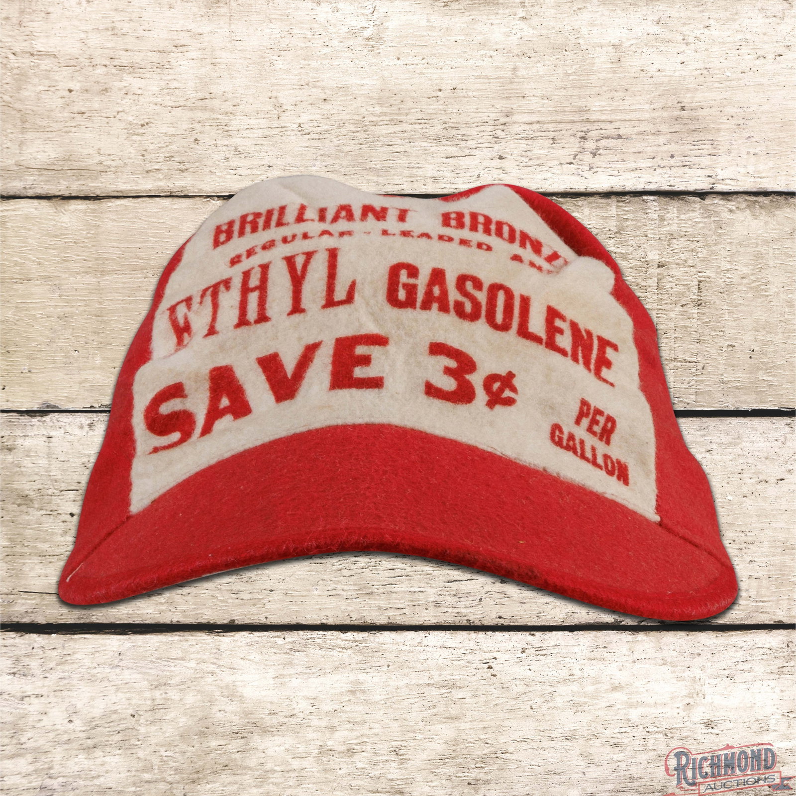 Scarce Johnson Brilliant Bronze Ethyl Gasolene Service Station Cap Hat: Cloth advertising cap with mannequin head display has very good color. The hat is in very good condition with minor age toning to the white. Overall a fantastic display piece. 4.5" H X 6" W X 9.5" D. 