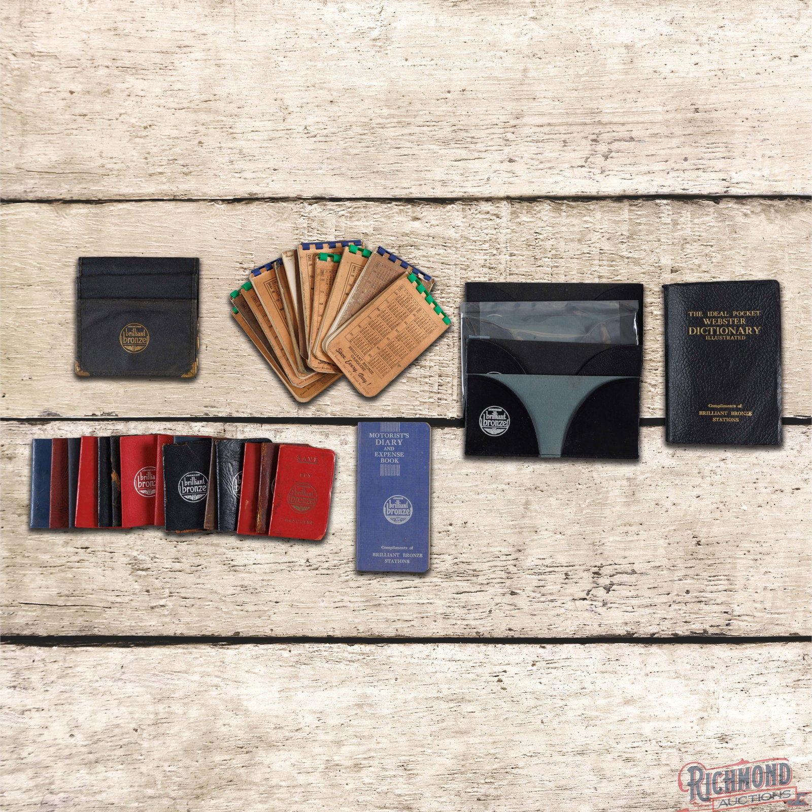 Group of 35 Johnson Brilliant Bronze Service Station Books Pads Holders: Large group of Johnson service station items includes pads, a Webster Dictionary, card holders and more. The items are in good condition with some having missing pages, wear, and writing. 5.5" H X 4" 