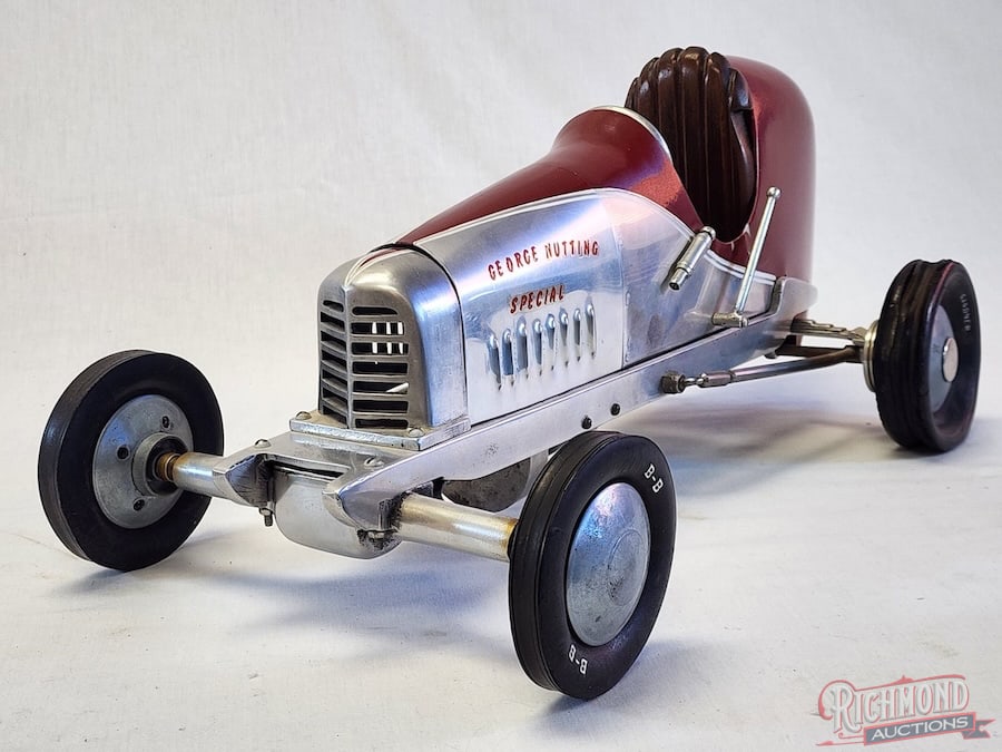 1939 Dooling Mercury Midget Tether Car: The Dooling Mercury Midget was also known as the 1st Series Front Drive. This car is all original with a wood tail section. Powered by a Brown Jr. engine, it was owned and raced by George Nutting. A f