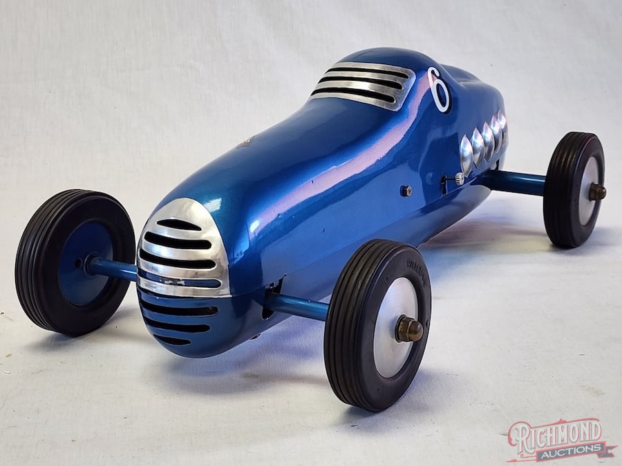 1942 Hiller Comet Tether Car: Stanley Hiller introduced the Hiller Comet in 1941 as a true innovation in the tether car world. This example is very rare due to the die formed aluminum body and pan. This car is powered by the