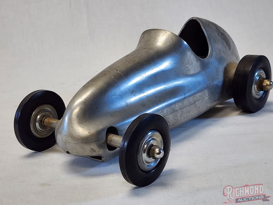1940 Dooling Pee Wee Tether Car: Developed by the Dooling Brothers, this 12? long racer was designed for engines .36 to .45 displacement directly driving the left rear wheel. This example was never fitted with an engine. Considered t