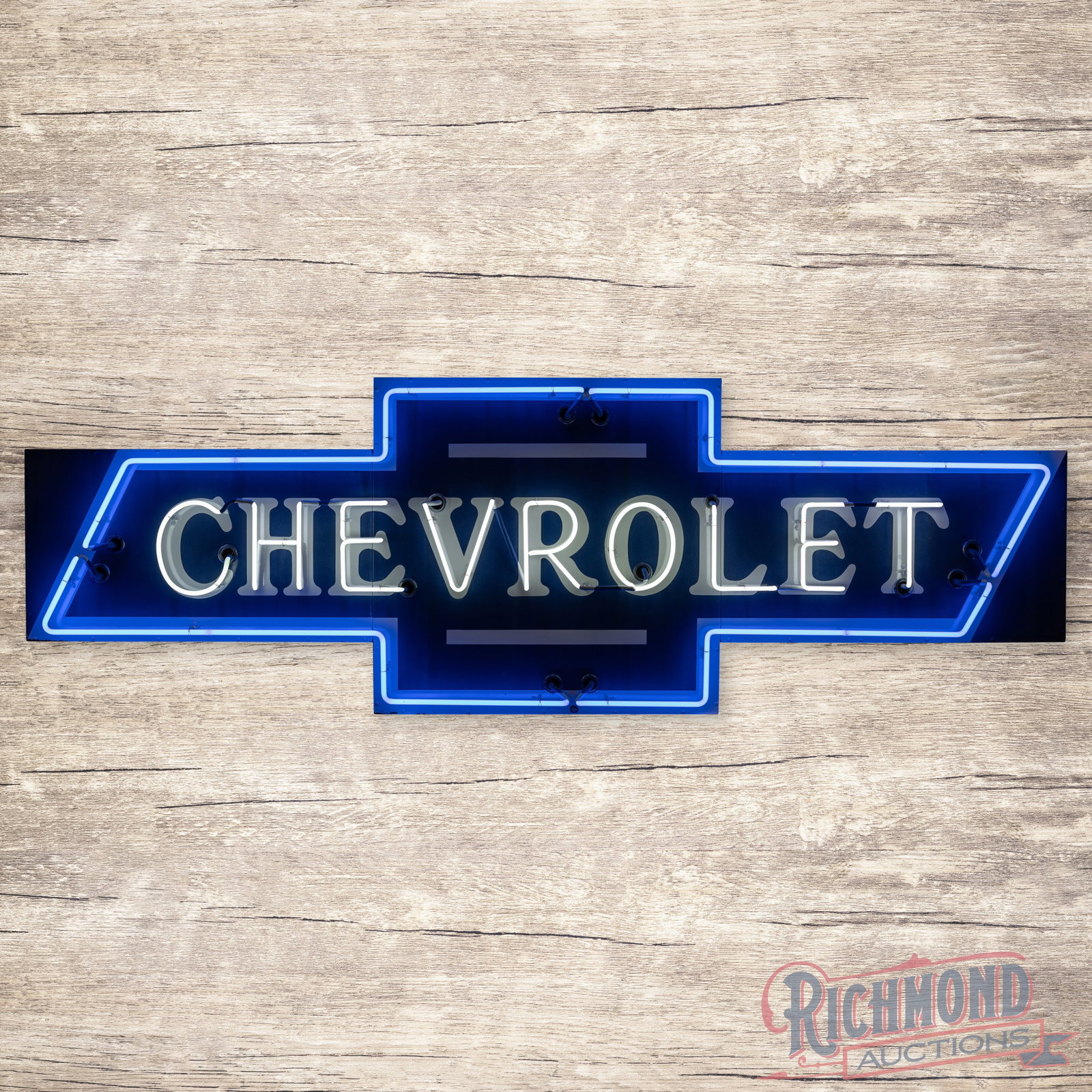 Chevrolet Bowtie 9' Single Sided Porcelain Die Cut Neon Sign: SSP (single sided porcelain) die cut neon sign with a metal can has very good color and gloss. The display has slight fading to the blue porcelain enamel with tiny color-matched chips at the neon hard