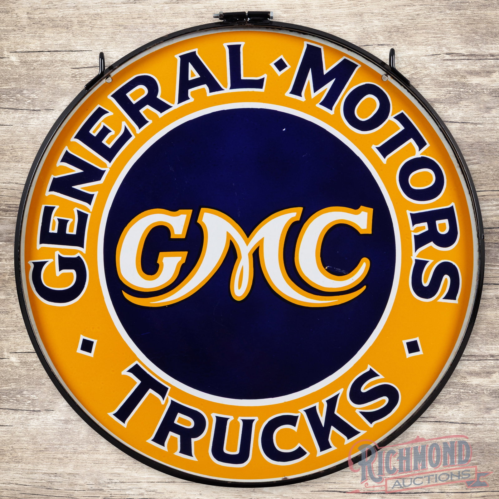 GMC General Motors Trucks 30" Double Sided Porcelain Sign w/ Ring: DSP (double sided porcelain) sign with a metal ring has excellent color and gloss. Side #1 has light wear in the fields with a tiny chip above the "G" in GMC. The perimeter has a chip on the lower edg