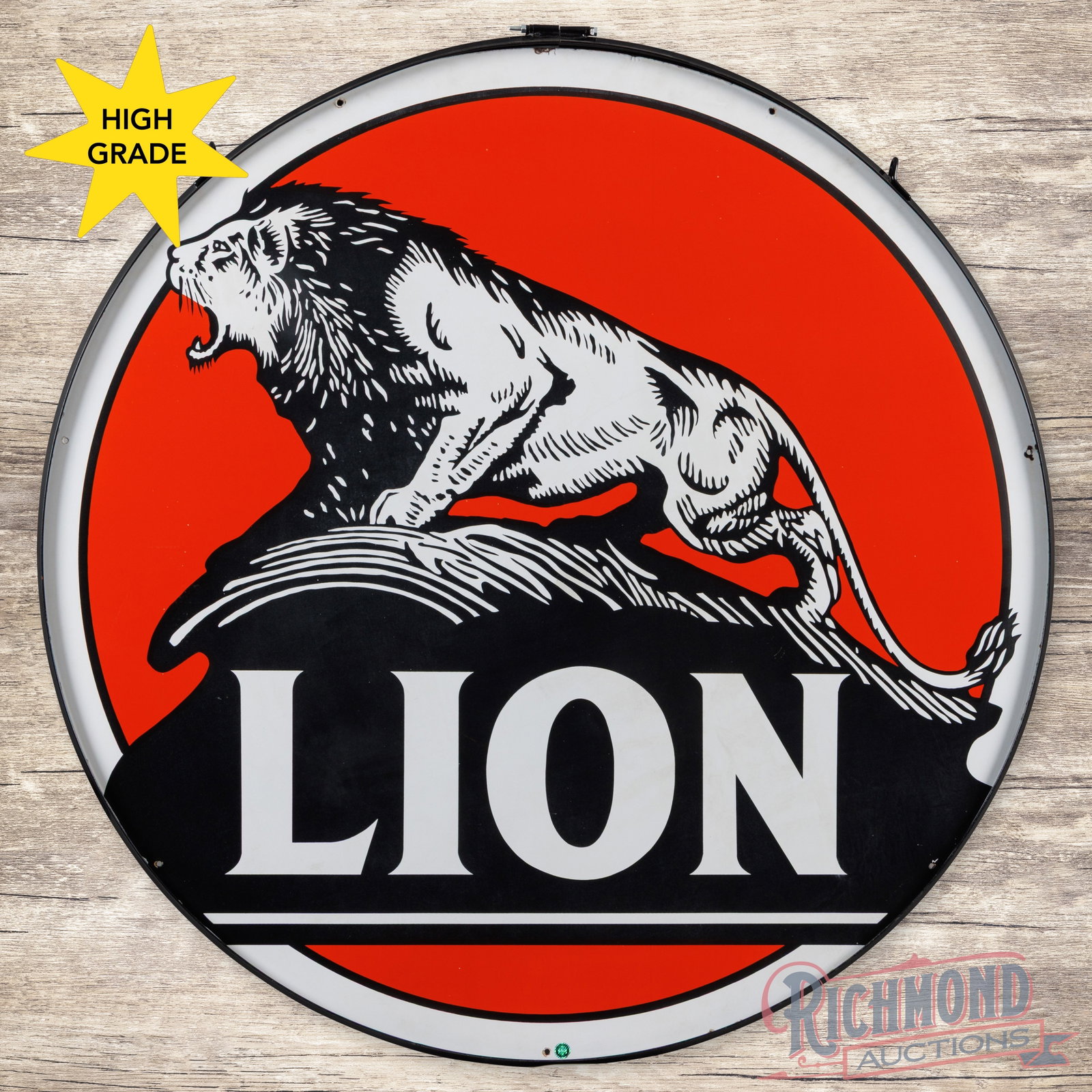 Lion Gasoline "Lion on the Rock" 5' Double Sided Porcelain Sign w/ Ring: DSP (double sided porcelain) sign with a metal ring has very good color and gloss. The display has a clean field with minor discoloration in the e lettering and faint cloudiness to the black porcelain