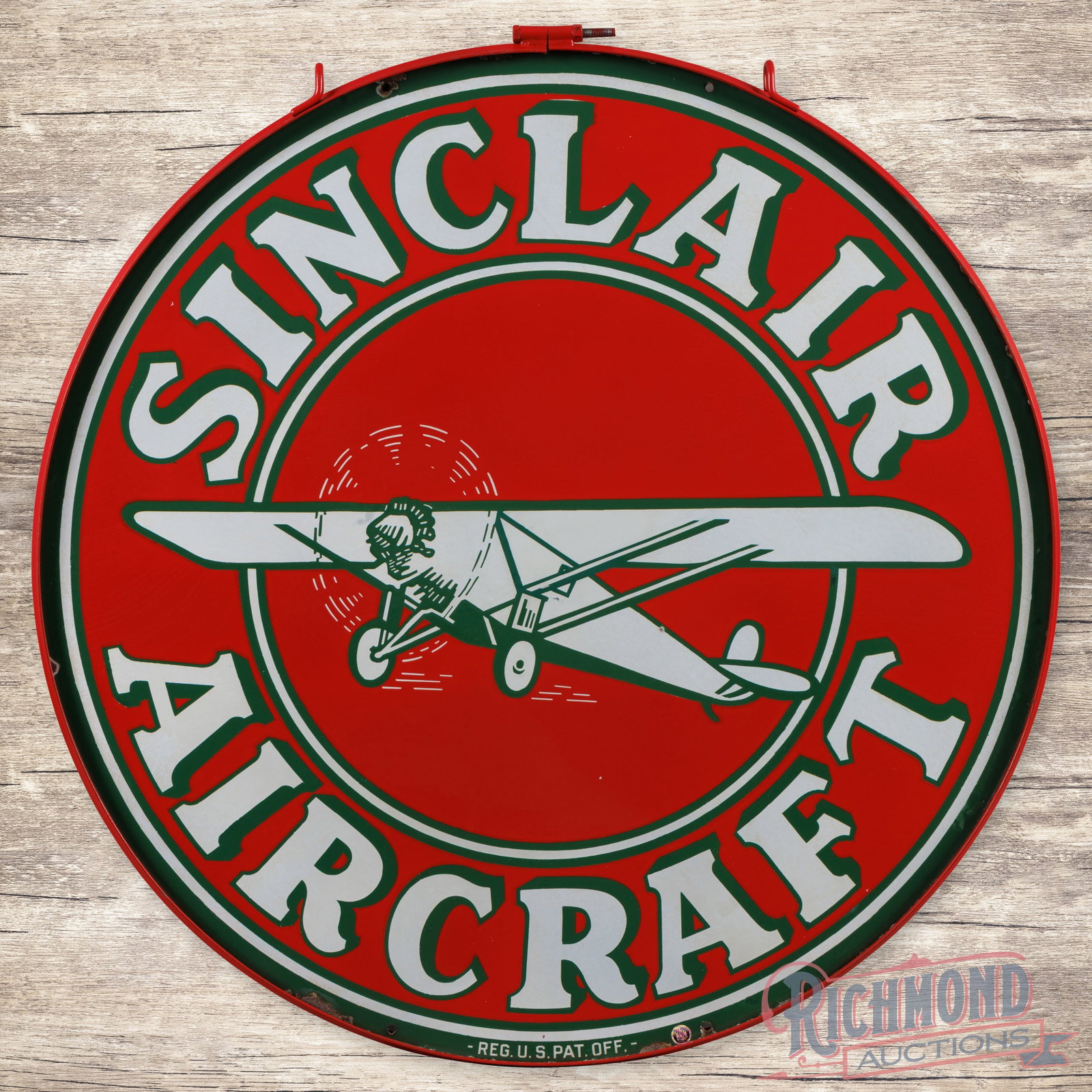 Sinclair Aircraft 48" Double Sided Porcelain Sign w/ Ring & Monocoupe: DSP (double sided porcelain) sign has excellent color and gloss. The sign features vibrant colors with a large plane graphic in the center field. The display has a six-inch area in the center that has