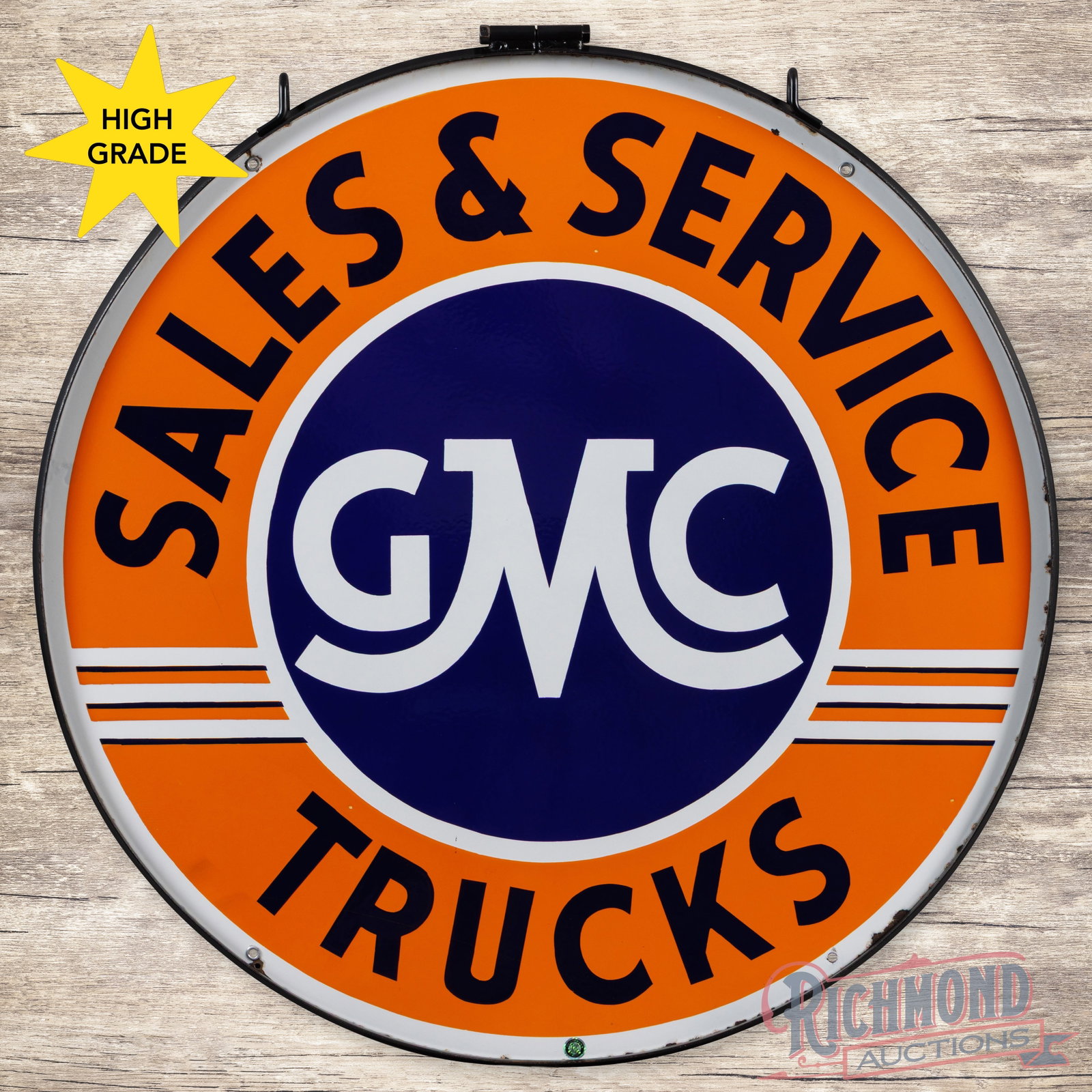 GMC Trucks Sales & Service 42" Double Sided Porcelain Sign w/ Ring: DSP (double sided porcelain) sign with a metal ring has outstanding color and gloss. The display has a clean field with minor perimeter chips and a tiny non-factory hole on the lower left edge. The re