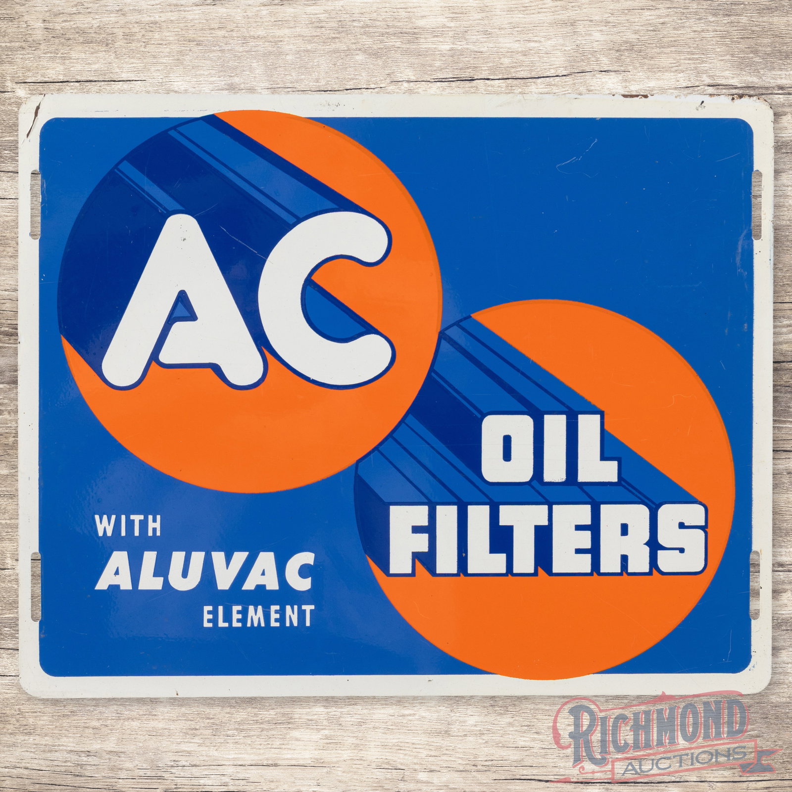 AC Oil Filters "With Aluvac Element" Single Sided Tin Sign: SST (single sided tin) sign has excellent color and shine. The display has light wear with faint paper marks. The perimeter has minor bends with paint chips along the outer edges. The sign displays we