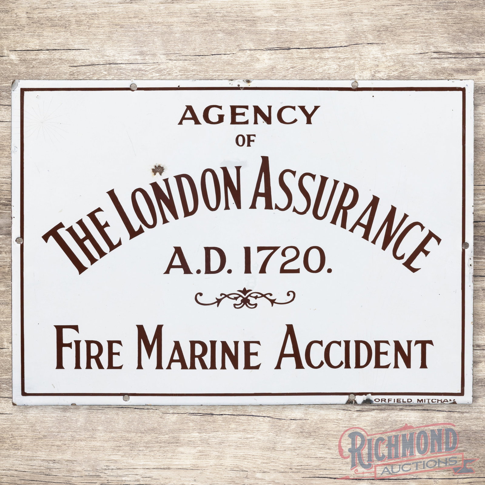 Agency of The London Assurance Fire Marine Accident Single Sided Porcelain Sign w/ Logo: SSP (single sided porcelain) sign has excellent color and gloss. The display has a chip above the "N" in London. The perimeter has chips with areas of crazing and a minor bend on the upper left corner