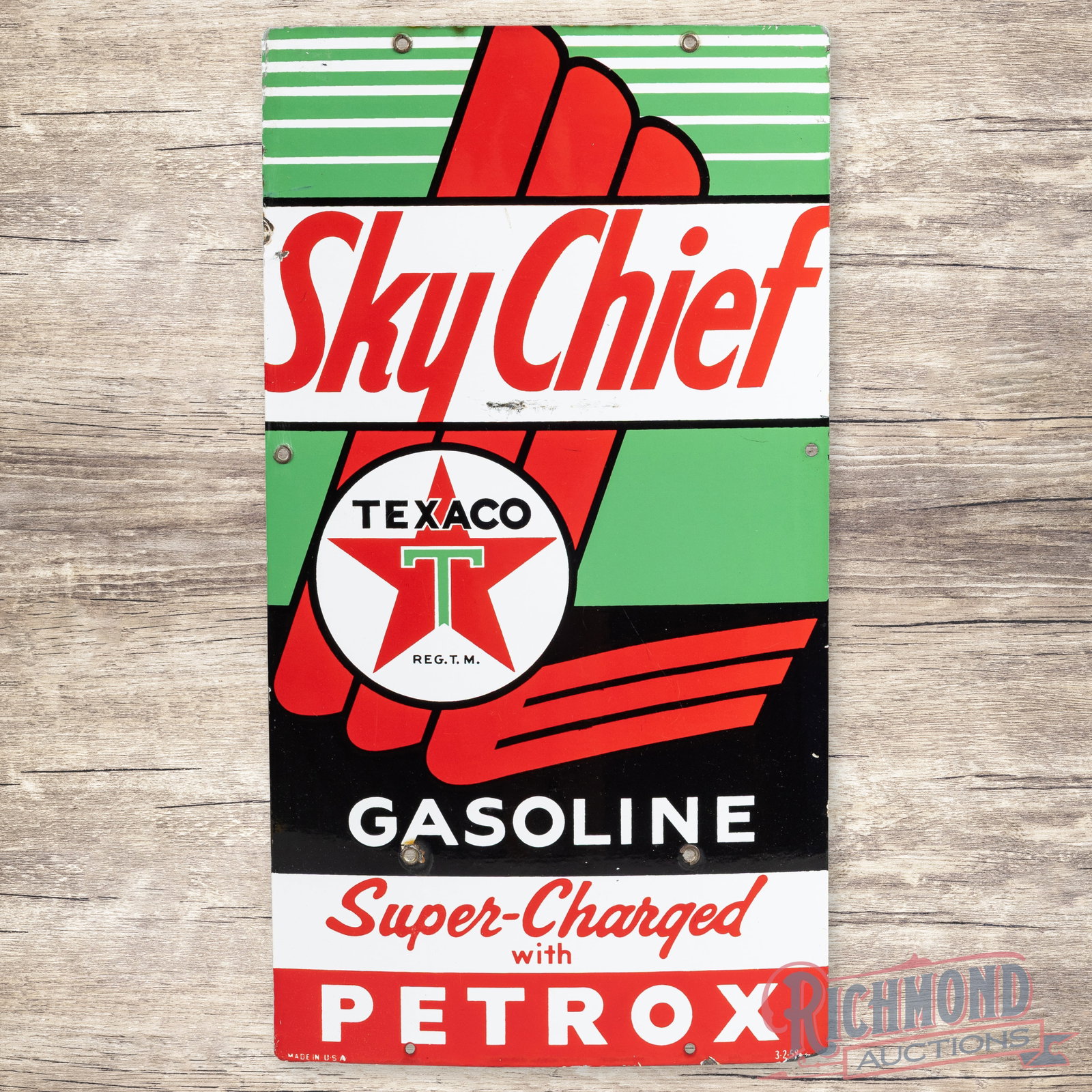 1958 Texaco Sky Chief Gasoline Super-Charged w/ Petrox Porcelain Pump Plate Sign "Large": SSP (single sided porcelain) pump plate has excellent color and gloss. The display has light wear with scuffs below the "CH" in Chief. The perimeter has chips with a small bend on the upper left edge 