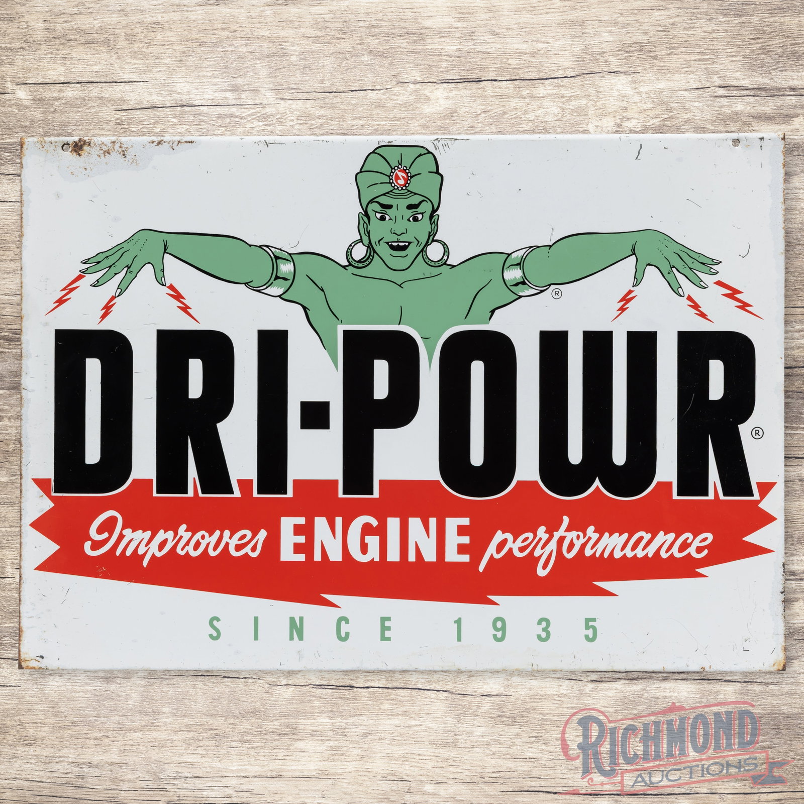 Dri-Power Improved Engine Performance Single Sided Tin Sign w/ Genie: SST (single sided tin) rack sign with a rolled upper edge has very good color and shine. The field has light wear with fine scratches in the outer fields. The perimeter has areas of oxidation and wear