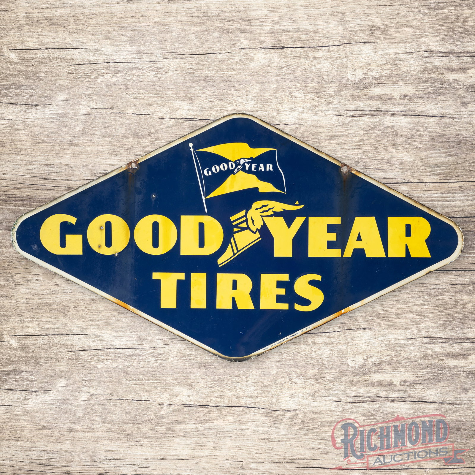 Goodyear Tires Double Sided Porcelain Sign w/ Wingfoot & Flag Logos: DSP (double sided porcelain) sign has good color. The display has small chips with fading and areas of discoloration. The perimeter has chips at the mounting holes and edges with errant paint drips an
