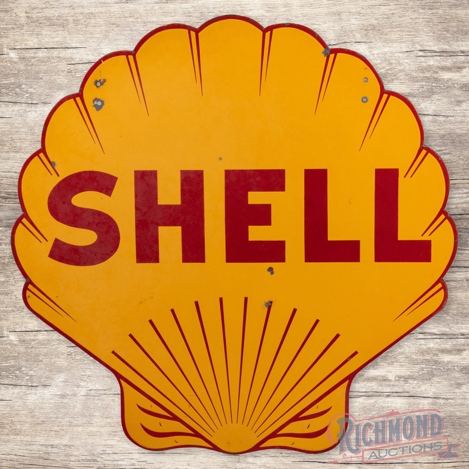 1937 Shell Gasoline Die Cut 48" Double Sided Porcelain Service Station Sign: DSP (double sided porcelain) die cut sign has very good color and gloss. The display has light wear with chips and bruises in the field. The lettering has faint areas of cloudiness and the upper left 