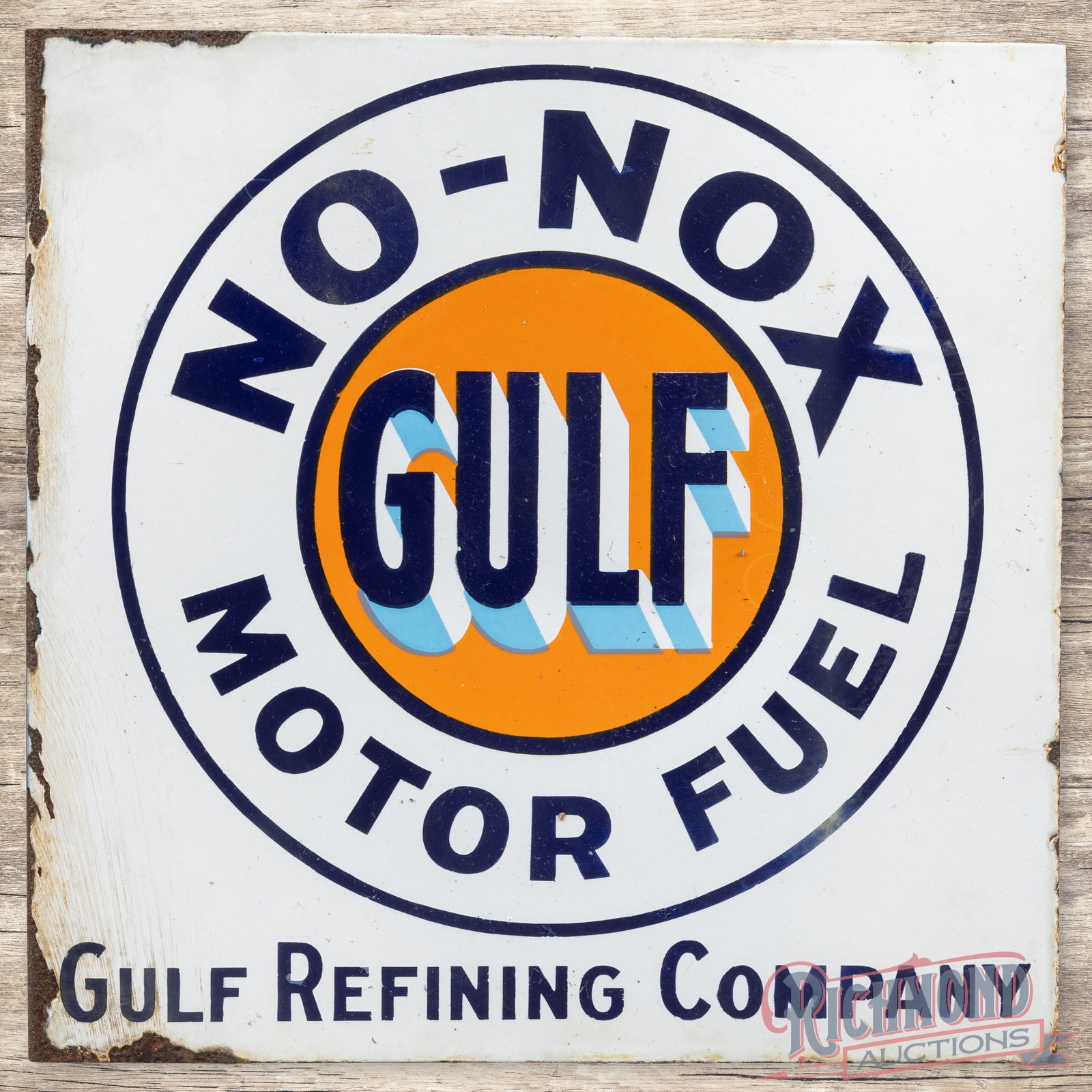 Gulf No Nox Motor Fuel Double Sided Porcelain Flange Sign w/ Logo: DSP (double sided porcelain) flange has good color and gloss. Side #1 has light surface wear with faint cloudiness and slight discoloration throughout. The perimeter has small chips along the edges wi