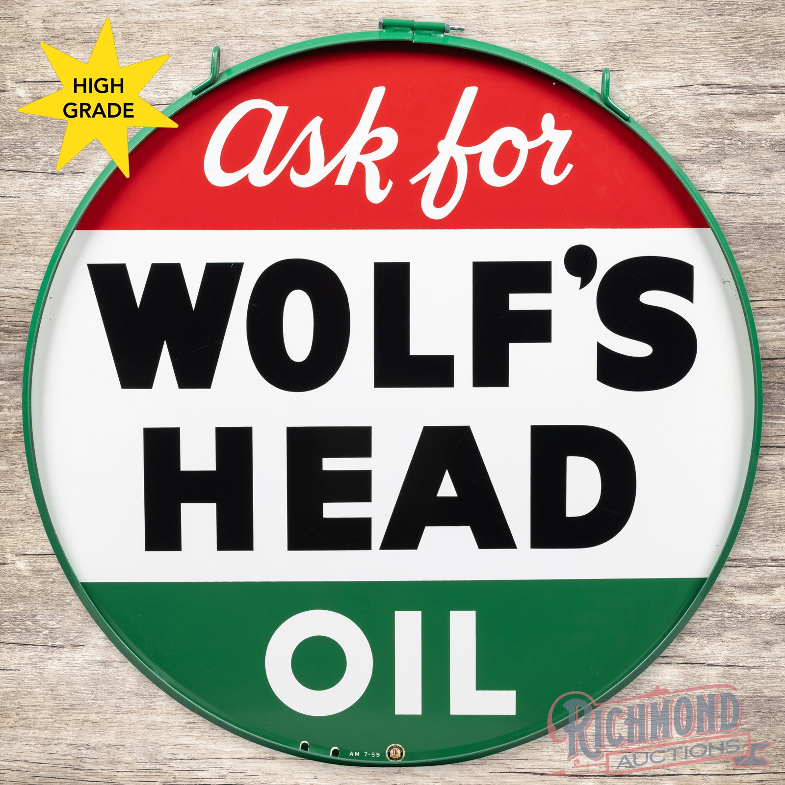 1955 Ask for Wolf's Head Oil 36" Double Sided Tin Sign w/ Ring: DST (double sided tin) sign with a ring has day one color and shine. The display has a clean field with minor wear along the perimeter and a tiny bend on the left edge. The reverse image is printed sl