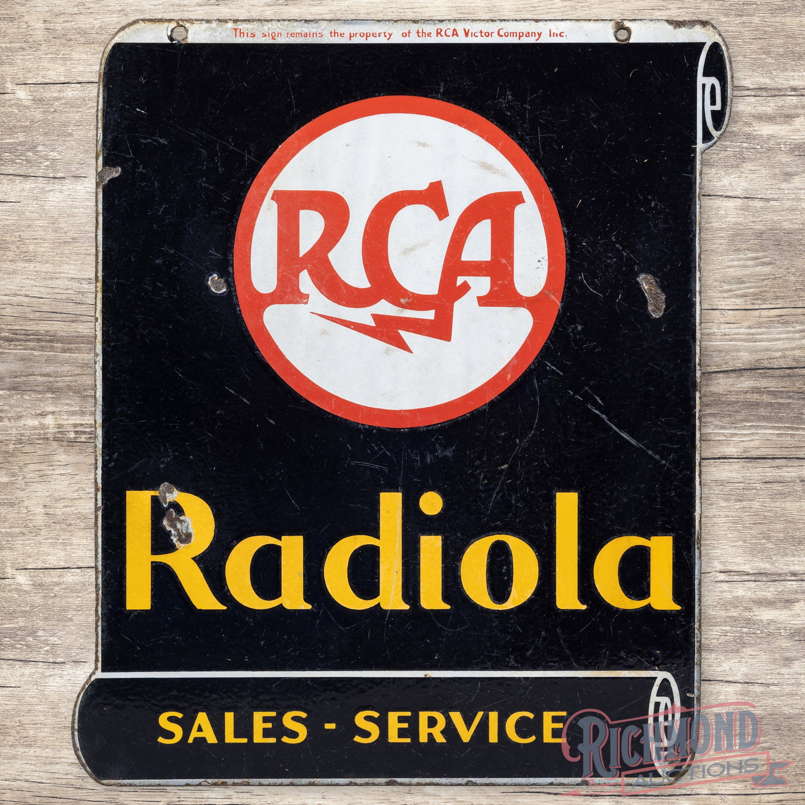 RCA Radiola Sales Service Double Sided Porcelain Scroll Sign: DSP (double sided porcelain) die cut sign has good color and gloss. The display has surface wear with chips and faint cloudiness. The reverse has slightly more wear than the display. Marked Property o
