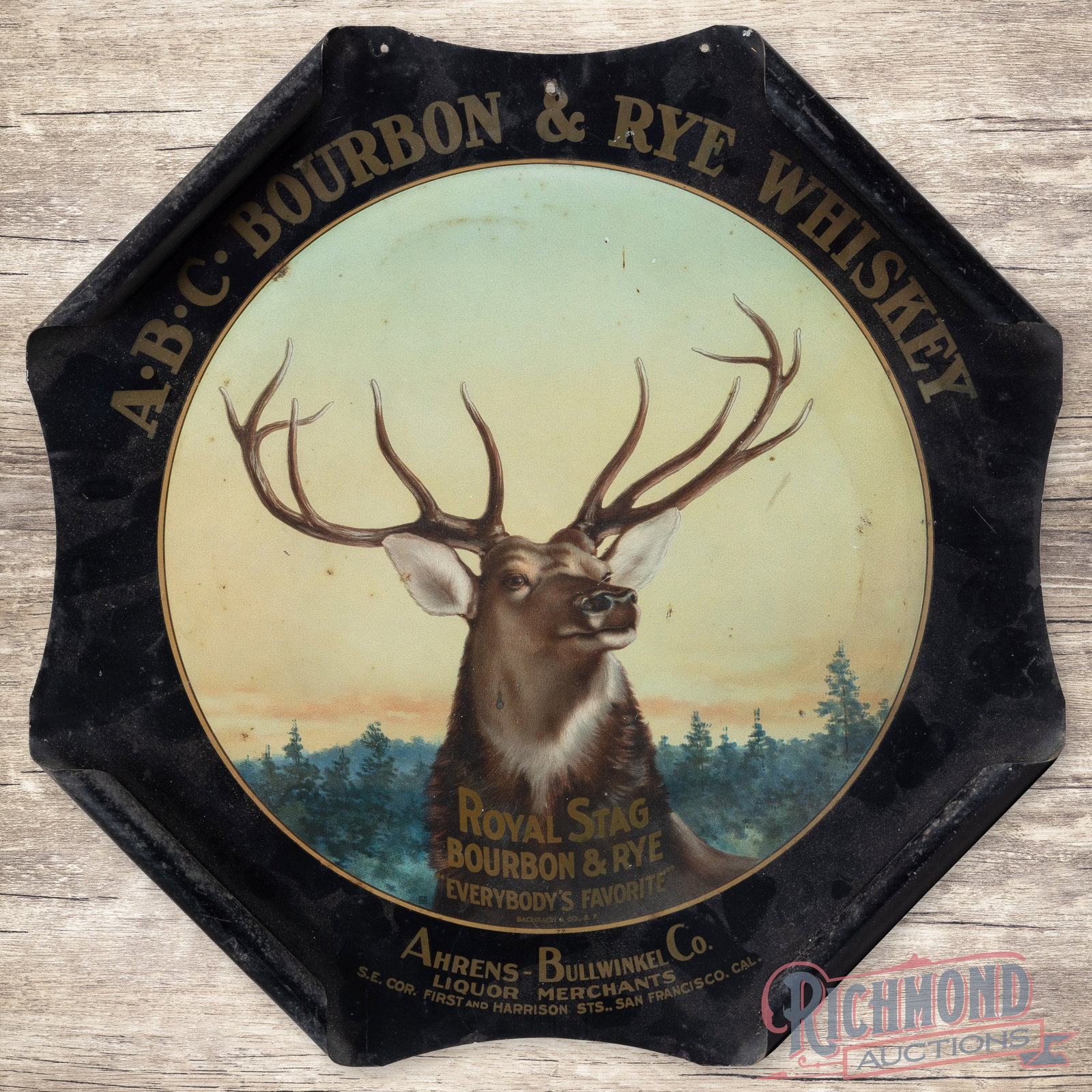 ABC Bourbon & Rye Whiskey Royal Stag "Everybody's Favorite" Curled Single Sided Tin Sign: SST (single sided tin) curled edge sign has very good color and shine. The display features highly detailed graphics of a stag with a scenic background. The field has light wear with small areas of ox