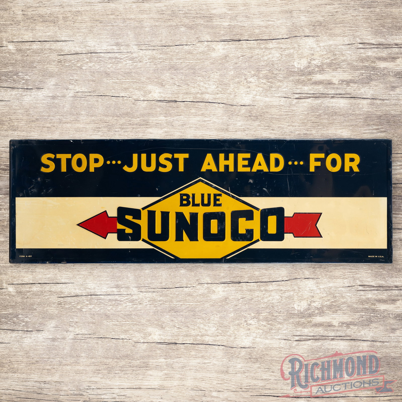 Stop Just Ahead for Blue Sunoco Gasoline 6' Emb. Single Sided Tin Logo Sign w/ Arrow: SST (single sided tin) embossed self-framed sign with a factory wooden support frame has very good color and shine. The display has toning with small indentations, scuffs and paint chips. The perimete