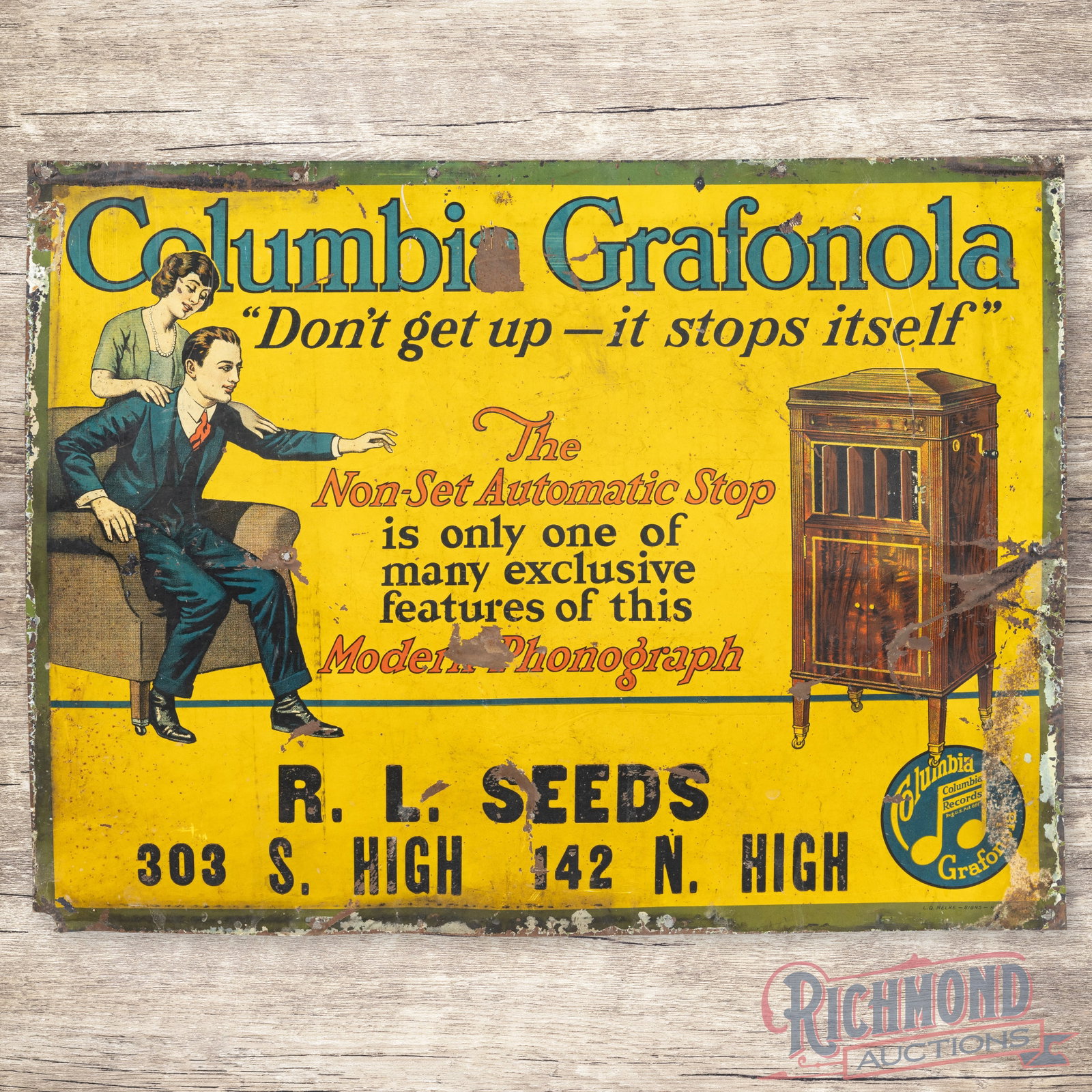 Columbia Grafonola "Modern Phonograph" Single Sided Tin Sign w/ Couple: SST (single sided tin) sign has good color and shine. The display has general wear with paint loss, fine scratches, non-factory holes and bends. The perimeter has errant paint with a small area of met
