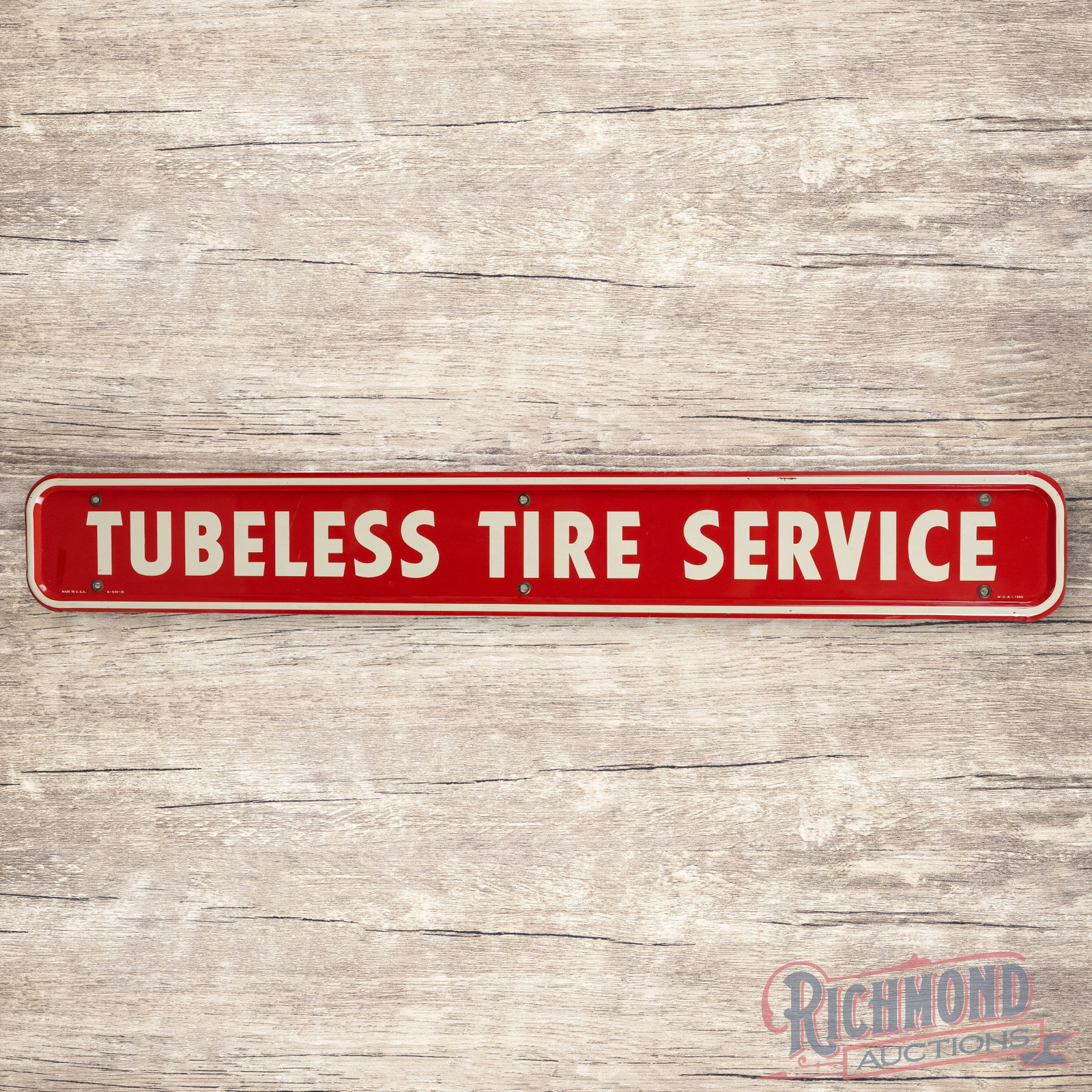 Firestone Tubeless Tire Service Single Sided Tin Sign: SST (single sided tin) self-framed sign has excellent color and shine. The field is very clean overall with minor surface imperfections and fine scratches beside the "L" in the left field. The perimet