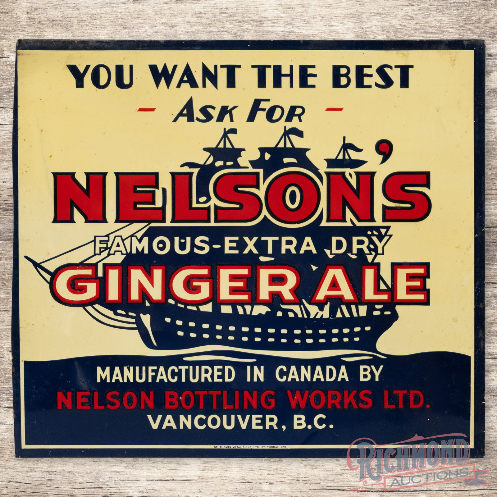 Nelson's Ginger Ale Emb. Single Sided Tin Sign w/ Ship Vancouver British Columbia: SST (single sided tin) embossed crimped edge sign has excellent color and shine. The display features a large ship graphic. The field has light wear with spotting in the outer fields. The perimeter ha