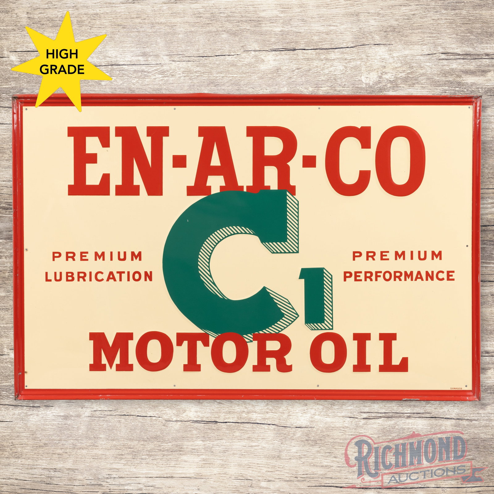 Enarco C1 Motor Oil Emb. Single Sided Tin Sign: SST (single sided tin) embossed self-framed sign has excellent color and shine. The display is exceptionally clean with a few minor factory blemishes. The perimeter has small scuffs, paint chips and m