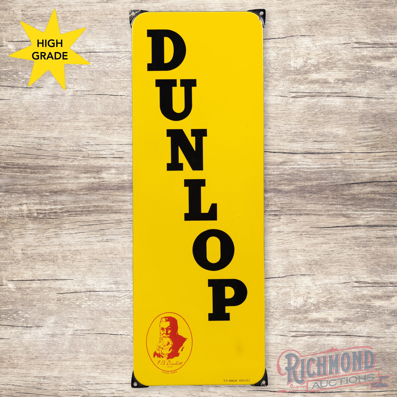 Dunlop Tires 35" Single Sided Porcelain Sign w/ JB Dunlop Logo: SSP (single sided porcelain) rolled edge sign has excellent color and gloss. The field is clean. The perimeter has small chips with a minor bend at the upper left mounting tab. Marked T.P. Brux, 1318/