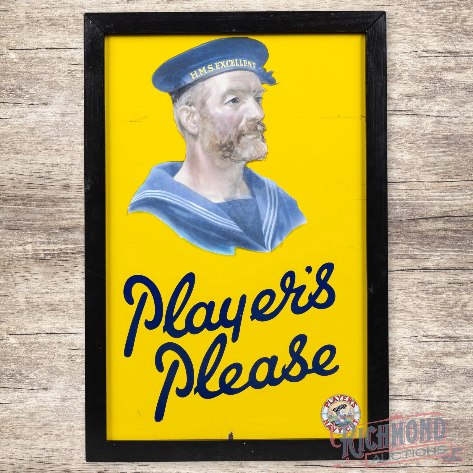 Player's Please Navy Cut Tobacco Single Sided Porcelain Sign w/ Hero: SSP (single sided porcelain) sign with an added wooden frame has excellent color and gloss. The display has a small chip on the sailor graphic with crazing in the upper left and right fields. The peri